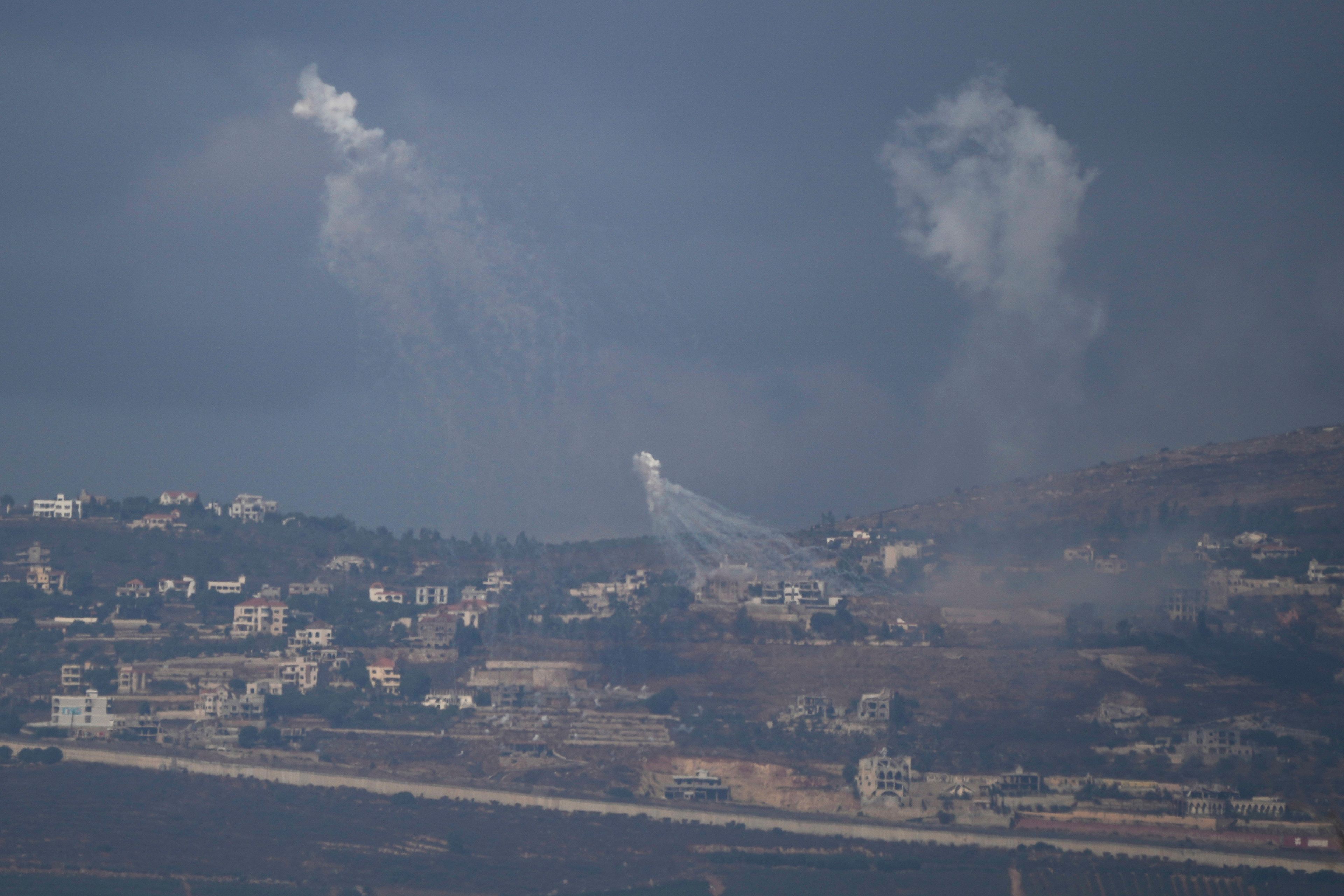 Israeli shelling hits an area in southern Lebanon as seen from northern Israel, Tuesday, Oct. 1, 2024. (AP Photo/Leo Correa)