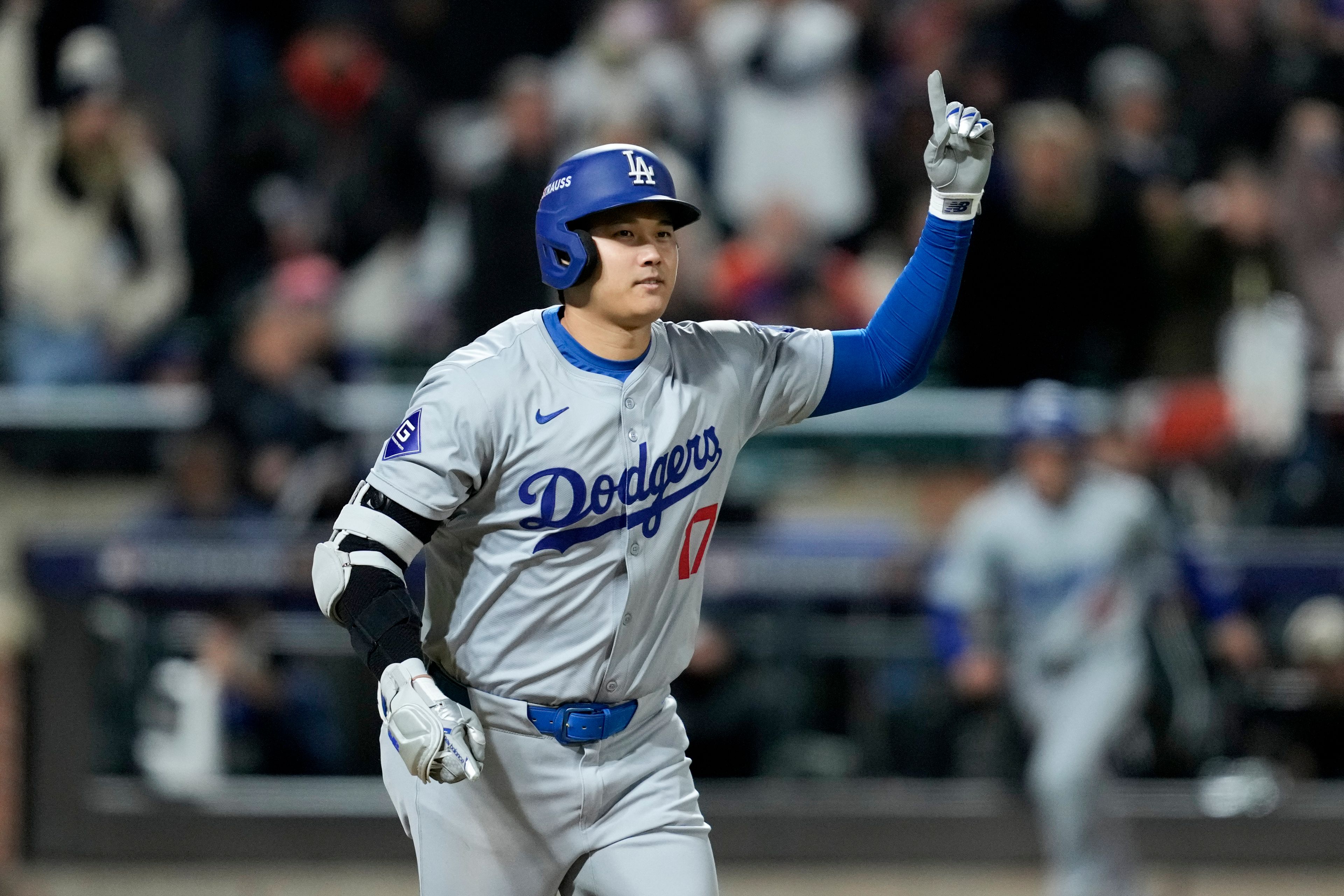 Los Angeles Dodgers' Shohei Ohtani celebrates his three-run home run against the New York Mets during the eighth inning in Game 3 of a baseball NL Championship Series, Wednesday, Oct. 16, 2024, in New York. (AP Photo/Ashley Landis)