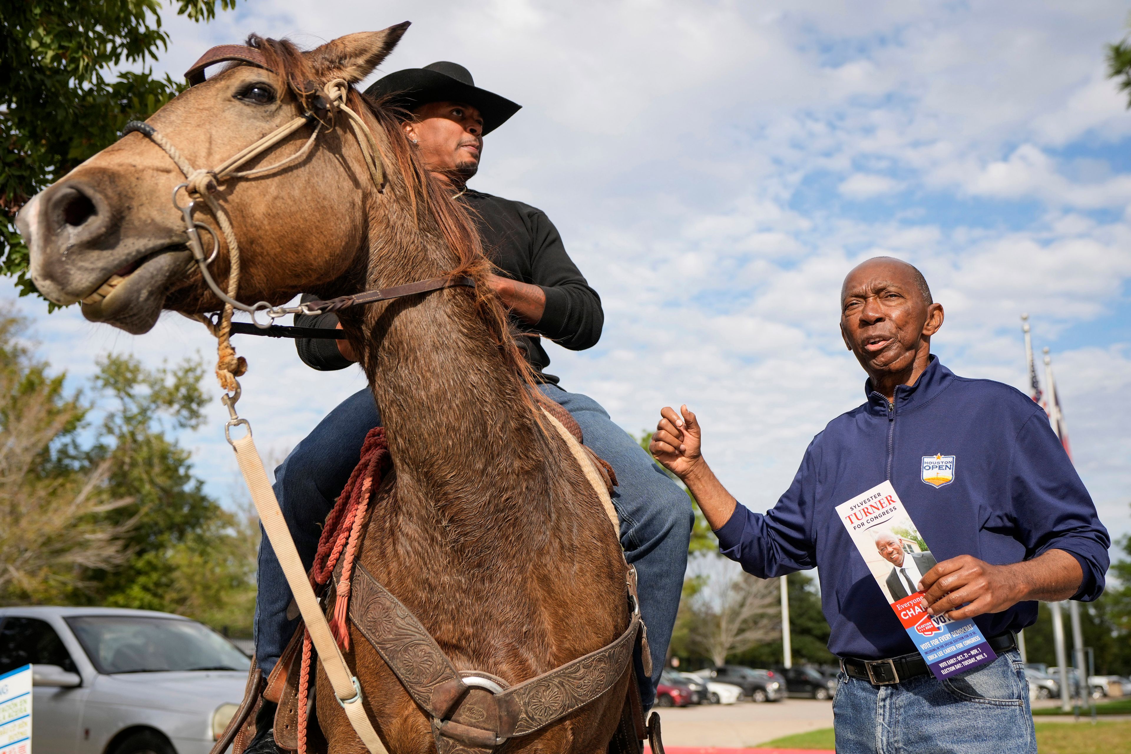 Rob Slater, left, talks to former Mayor Sylvester Turner as Turner campaigns for a seat in the U.S. House of Representatives at Lone Star College-Houston North Victory on Election Day, Tuesday, Nov. 5, 2024, in Houston. (Brett Coomer/Houston Chronicle via AP)