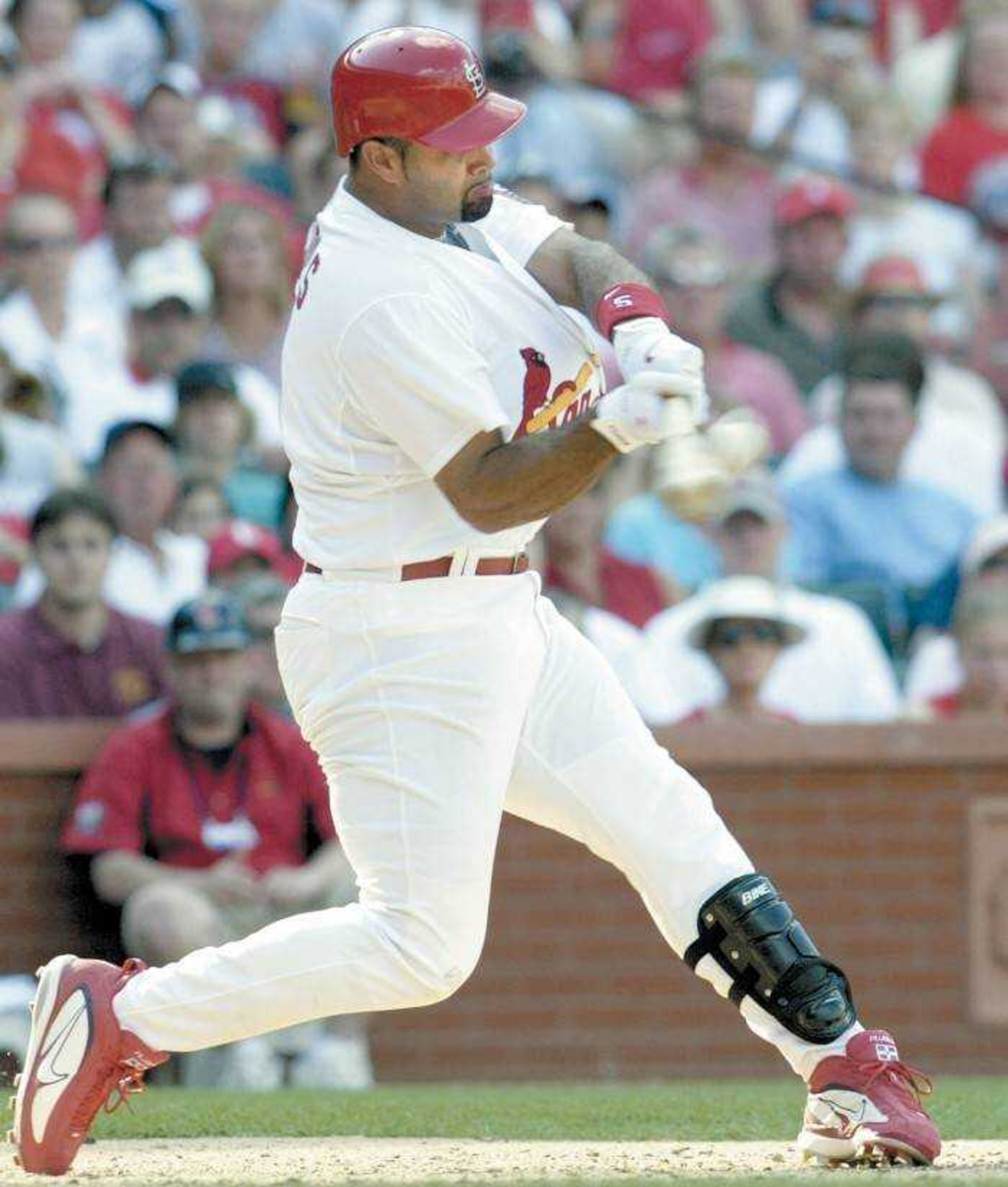 Albert Pujols connected for a three-run home run, his 25th of the season, on a pitch from Chad Qualls in the seventh inning. (Associated Press)