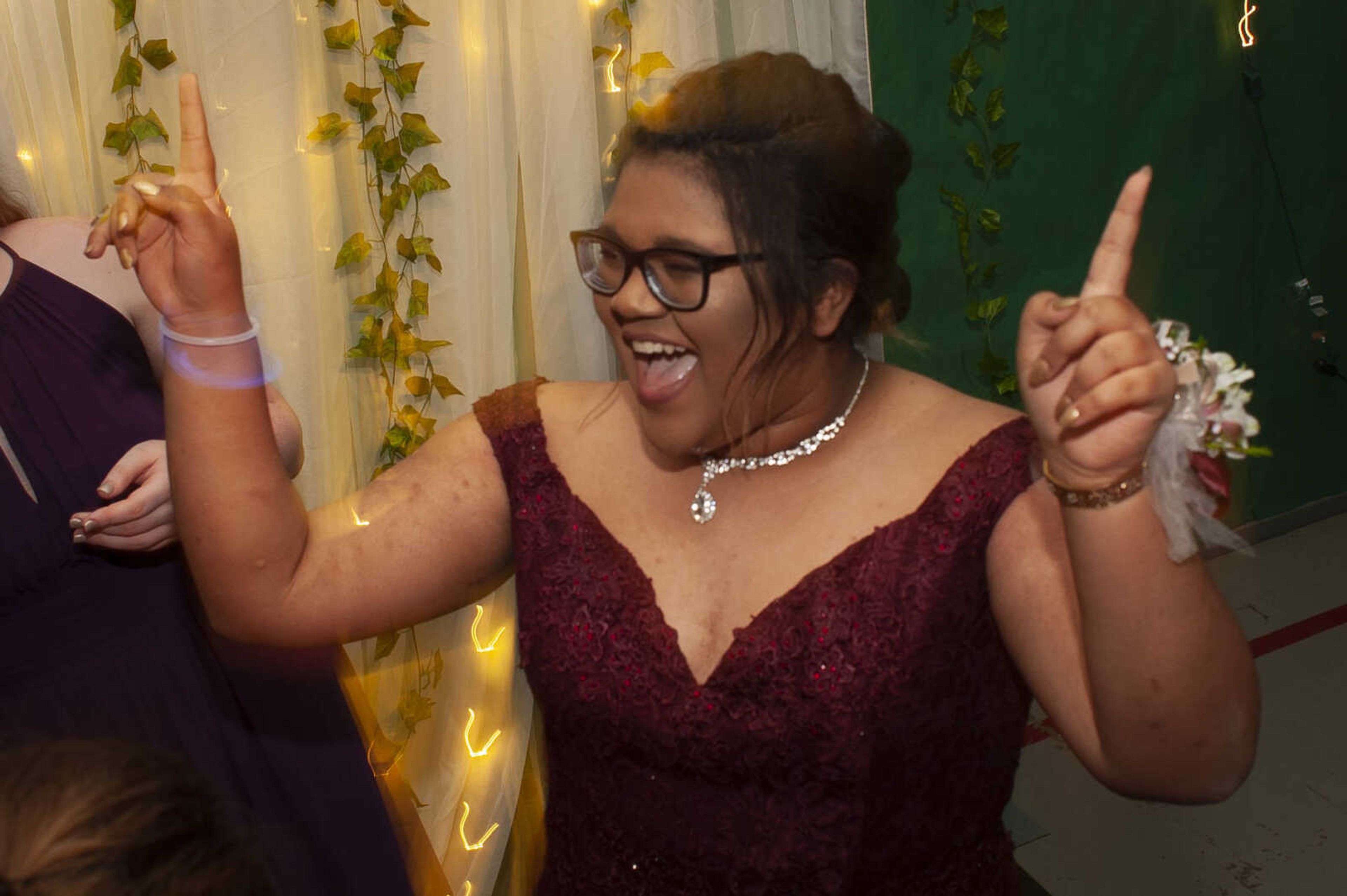 Delta sophomore Danielle Thomas puts her hands in the air during Delta High School's prom on Saturday, April 13, 2019, at the Delta Community Center.