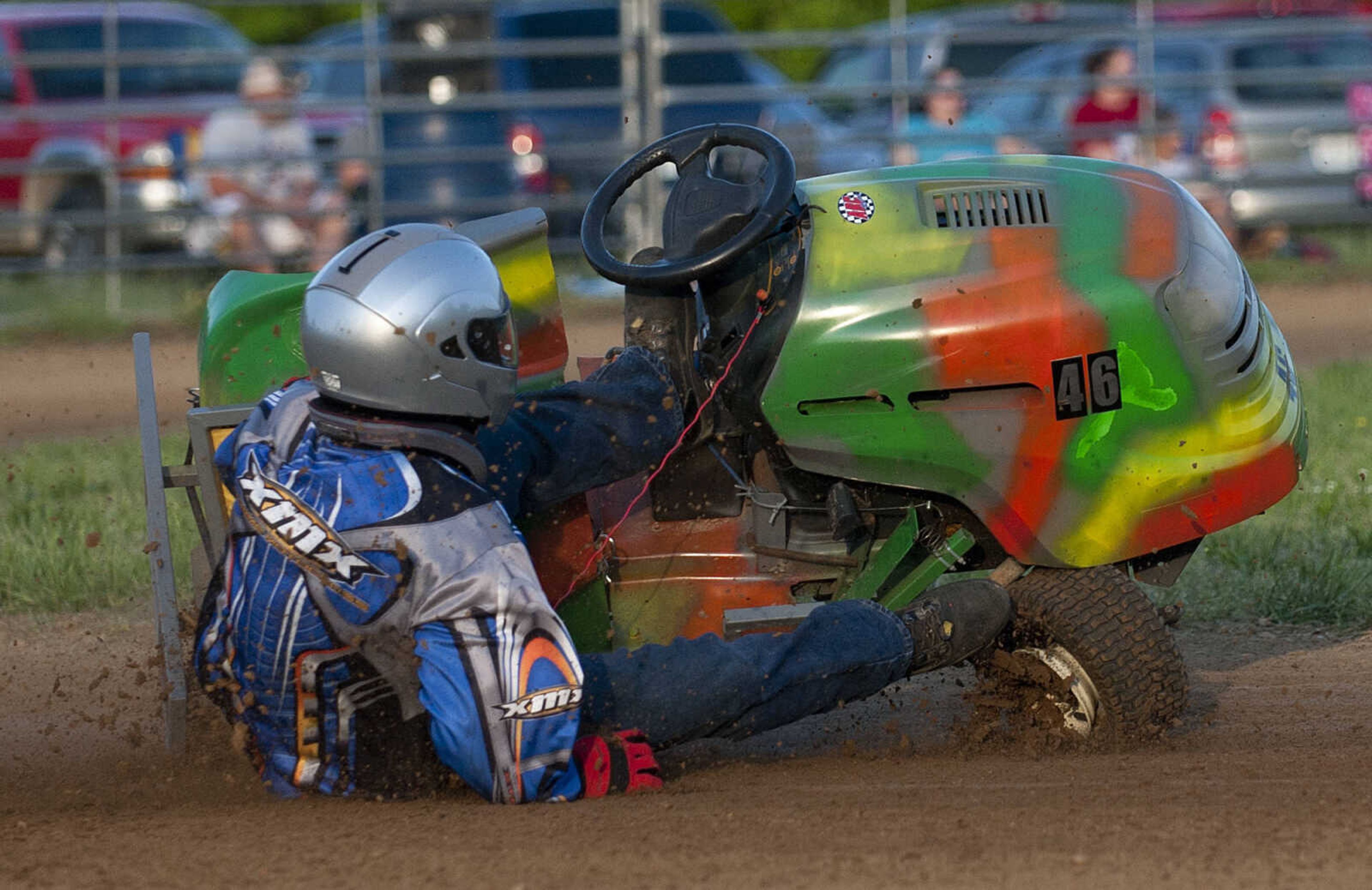 Vernon Yount crashes after losing his back wheel in turn three during the C Class heat during the Southeast Missouri Lawnmower Racing Association's Racing for a Cure presented by the Patton Lions Club at the Patton Saddle Club Saturday, May 10, in Patton, Mo.