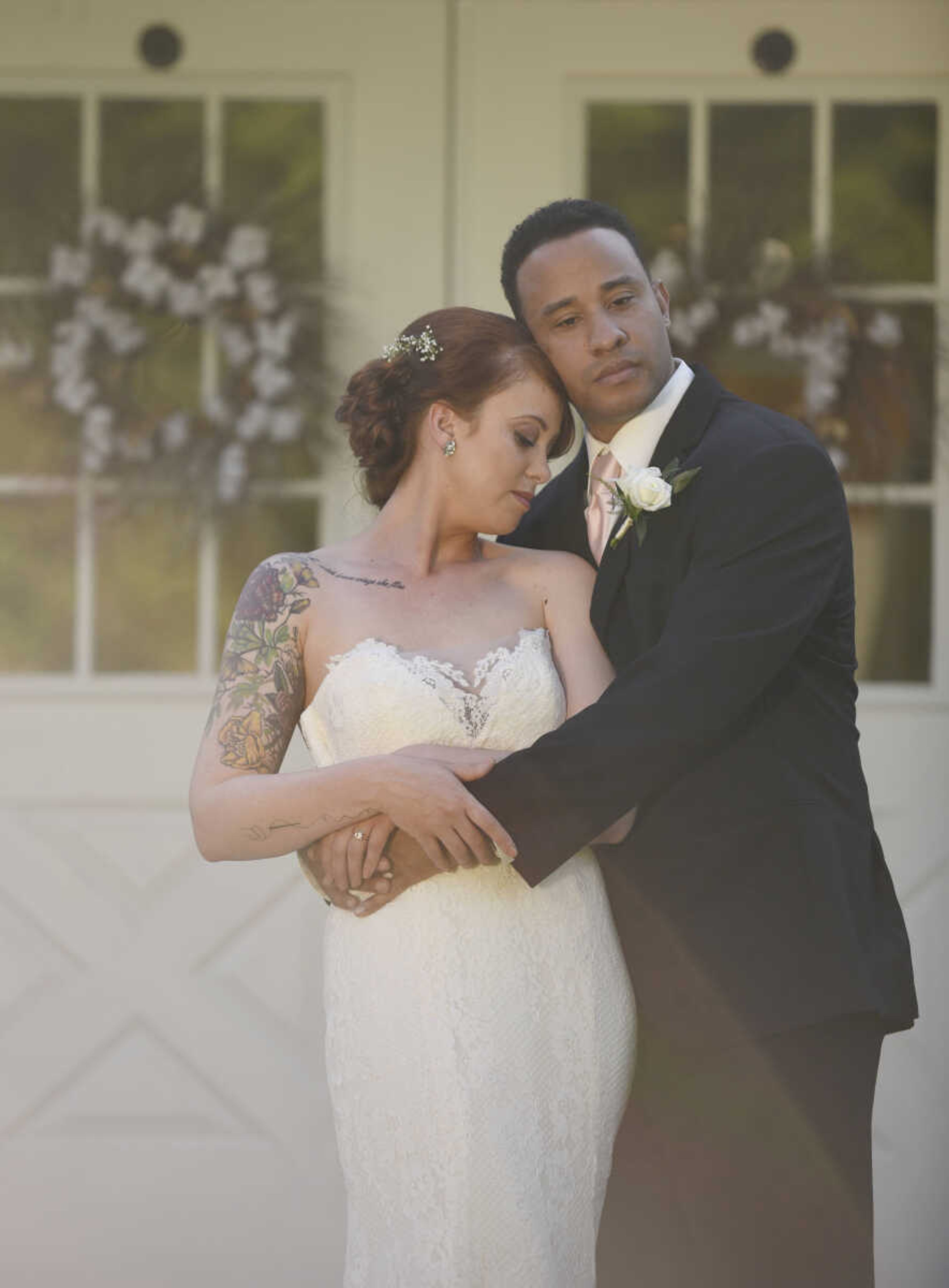 Alvina Valenta: Style 9656 
Ivory lace trumpet bridal gown with a strapless neckline and sheer lace back. Available at Magnolias Bridal Boutique in Cape Girardeau.

Earrings: Lindsay Marie Design : Style "Magnolia"


Wedding suits courtesy of Jim's Formal Wear and available at Garber's Men's Wear in Cape Girardeau.