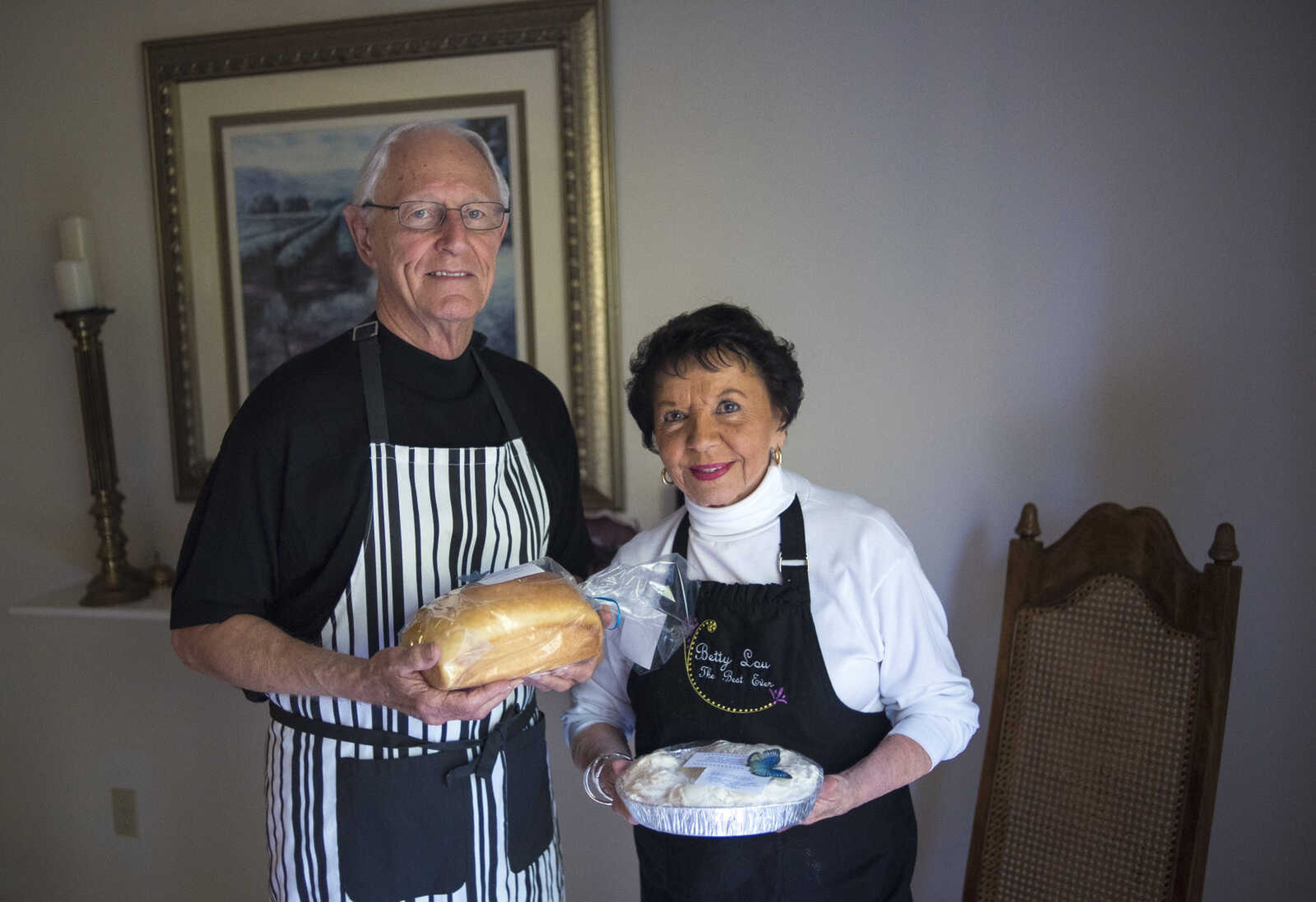 "We like the idea of giving." Betty Lou said while her and her husband Don Vogel pose for a photo while holding a loaf of sourdough bread and cinnamon rolls they made earlier that day Monday, Oct. 2, 2017 in Cape Girardeau.