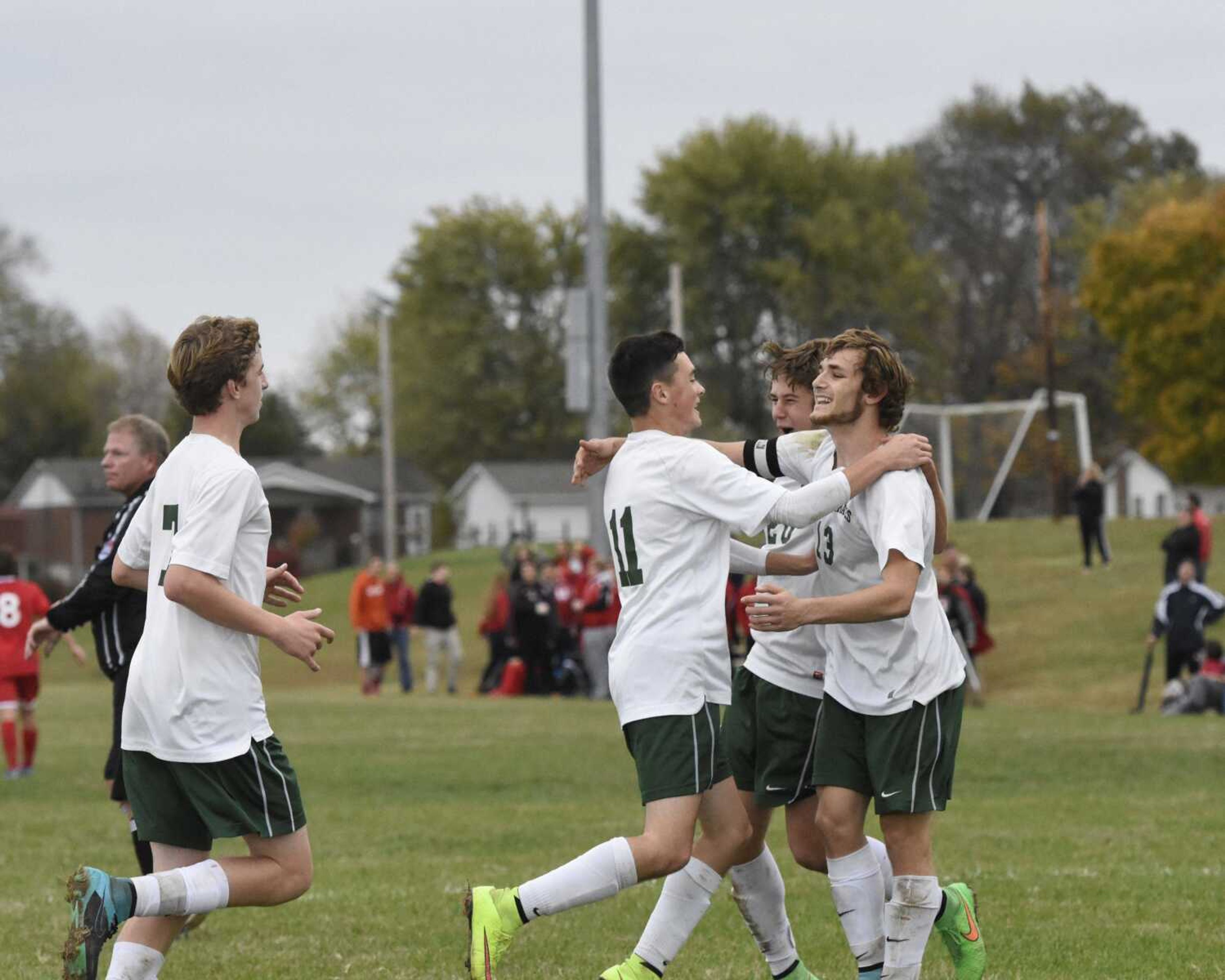 Perryville players celebrate after Kyle Wood, right, scores a penalty kick goal in the first half of a Class 2 quarterfinal Saturday in Perryville.