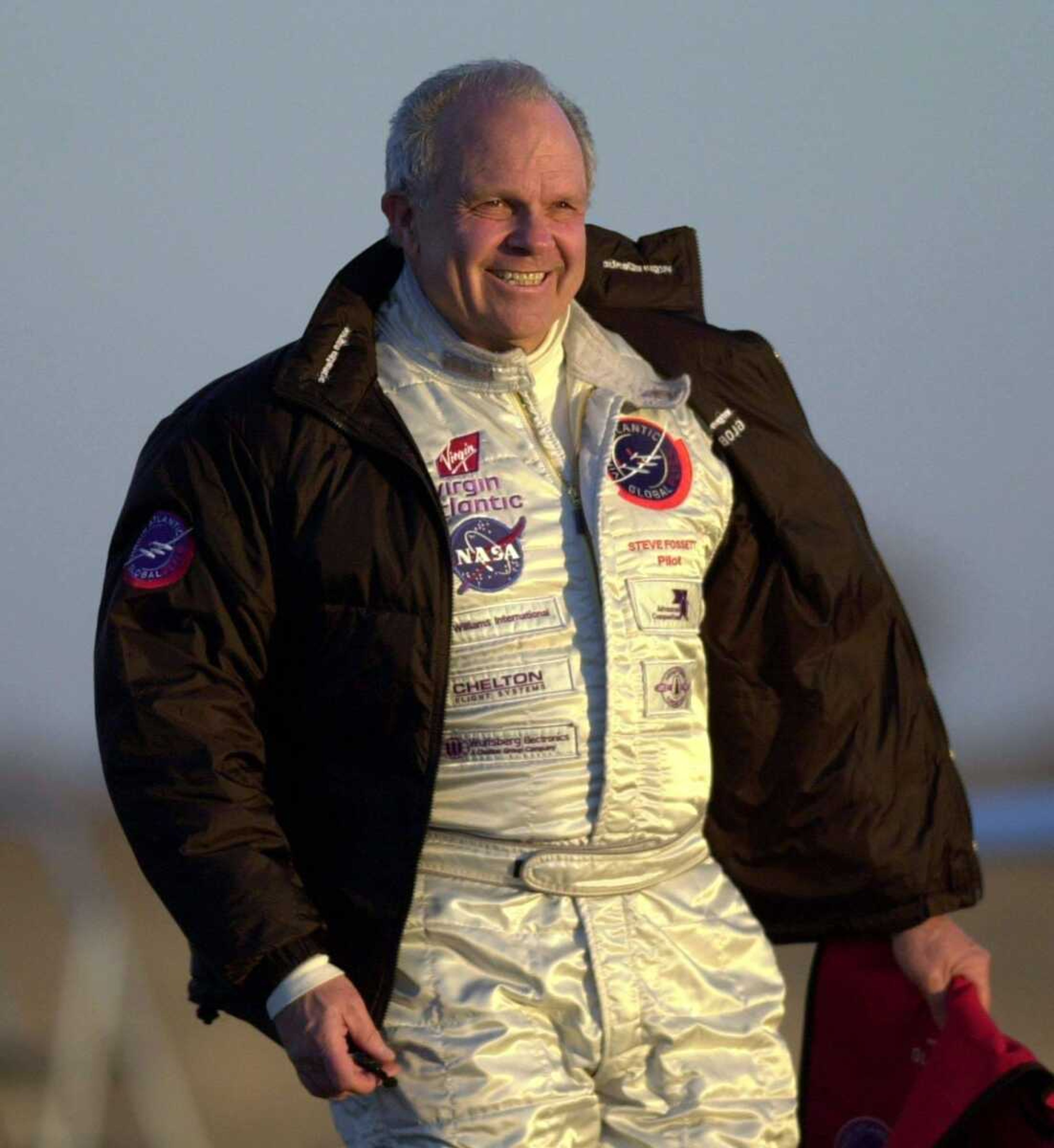 Charlie Riedel ~ Associated Press<br>Steve Fossett walks on a runway Feb. 28, 2005, at Salina Municipal Airport in Salina, Kan. Authorities said Monday they have identified some of his remains.