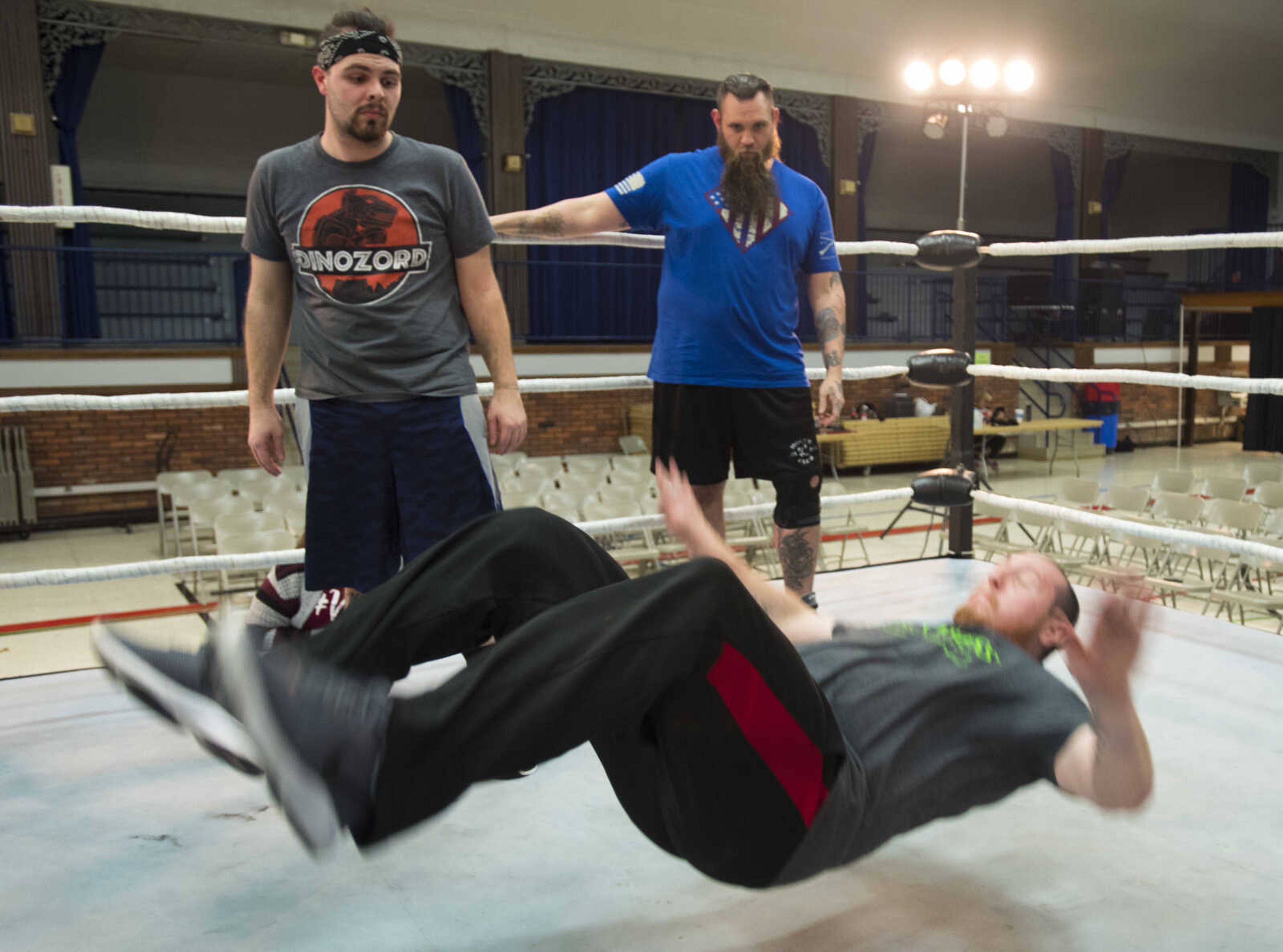 CCW wrestler Brandon "Barbwire" Anderson, below, demonstrates a "bump" while practicing before a One Night Riot event Saturday, Feb. 24, 2018, at the Arena Building in Cape Girardeau.