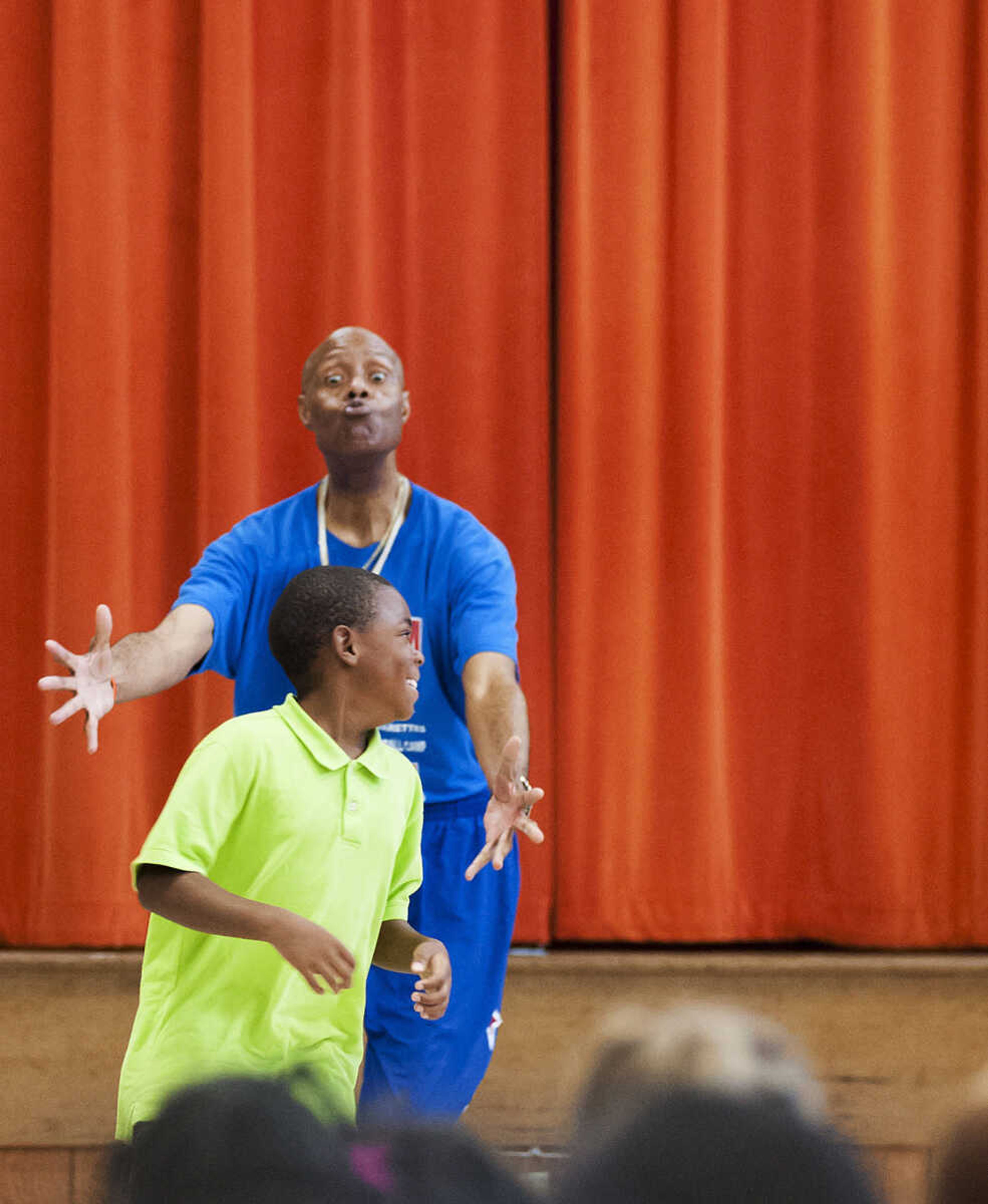 Captain "Magic" Valentino Willis gets some help from Jakari Beab during his presentation at Jefferson Elementary School Tuesday, Sept. 24, in Cape Girardeau. Willis, who is with the Harlem Swish Comedic Basketball Team, used his basketball and comedy skills to encourage the students to not smoke, drink or do drugs while respecting their teachers, principals, coaches and each other.