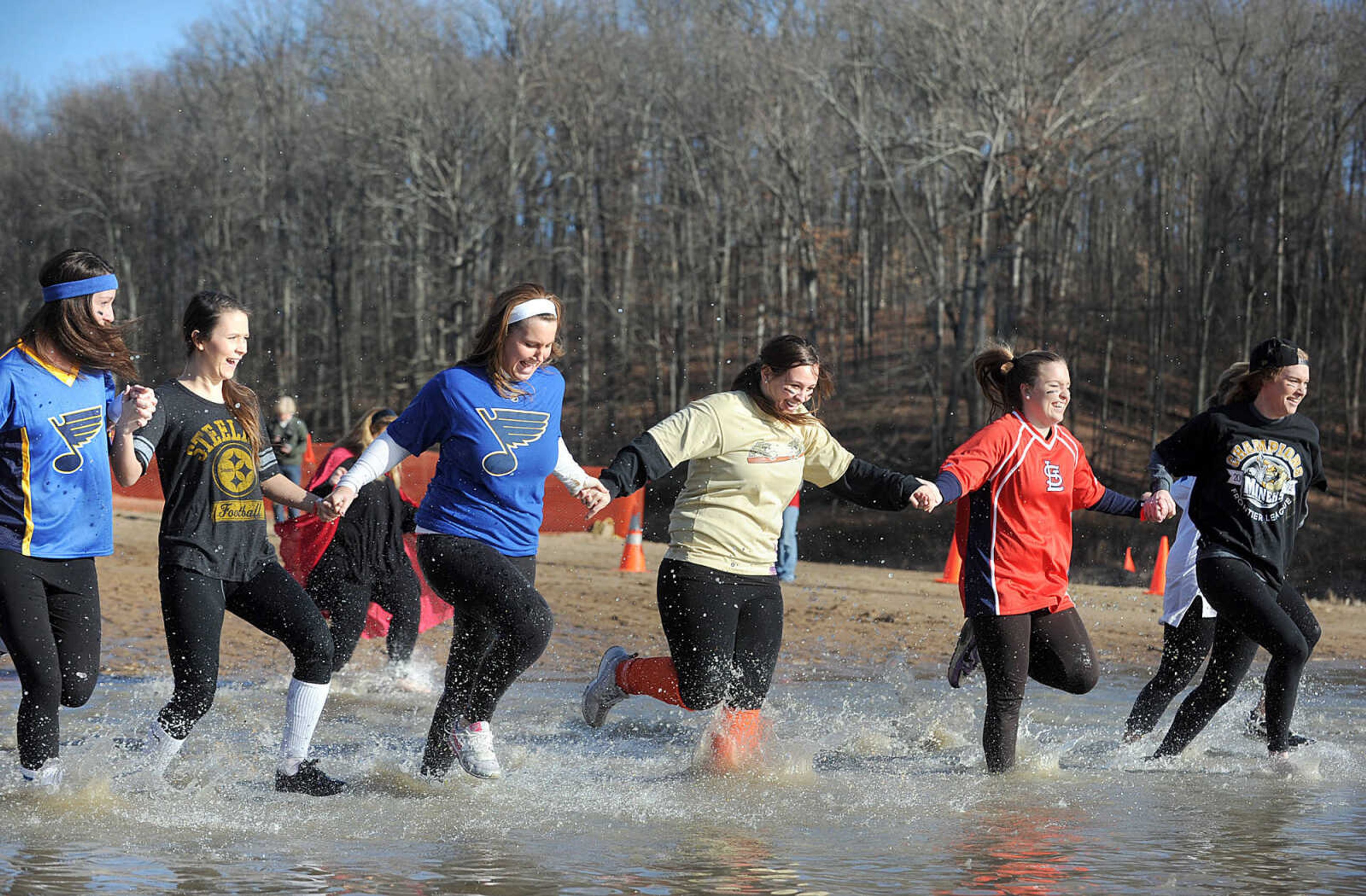 LAURA SIMON ~ lsimon@semissourian.com
People plunge into the cold waters of Lake Boutin Saturday afternoon, Feb. 2, 2013 during the Polar Plunge at Trail of Tears State Park. Thirty-six teams totaling 291 people took the annual plunge that benefits Special Olympics Missouri.