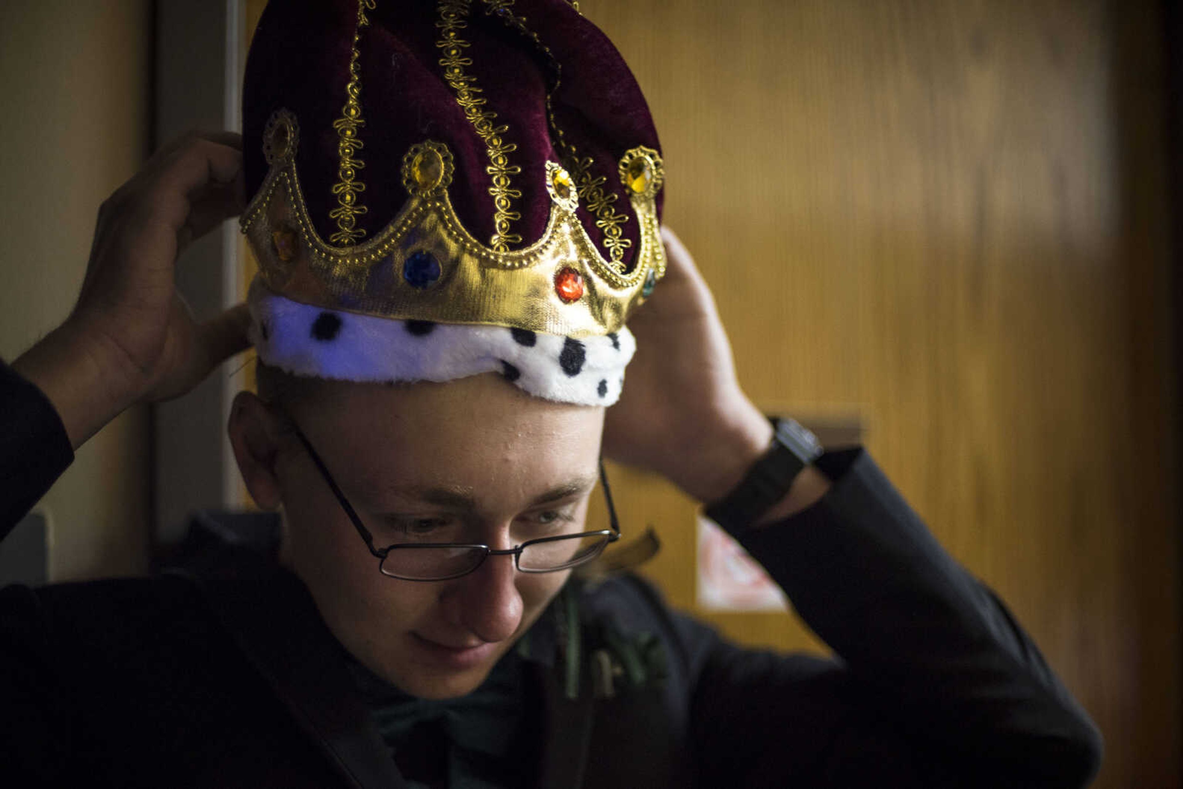 Returning Prom King Turk Smith dons the prom crown before a coronation ceremony during the Oak Ridge Prom Saturday, April 13, 2019, at the Jackson Elks Lodge in Jackson.