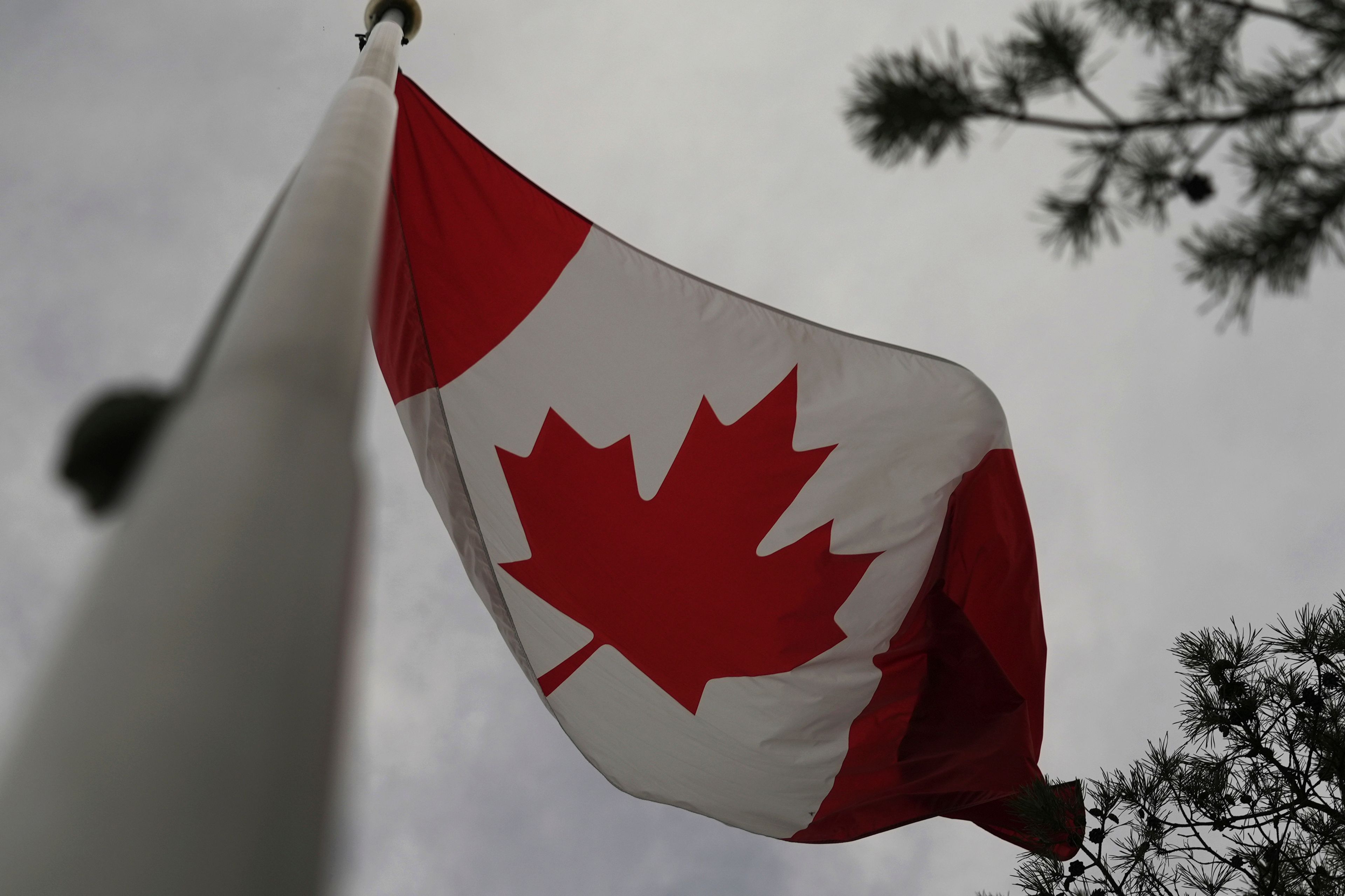 The Canadian flag is blown by wind on Centre Island in Toronto on Thursday, Sept. 19, 2024. (AP Photo/Angie Wang)