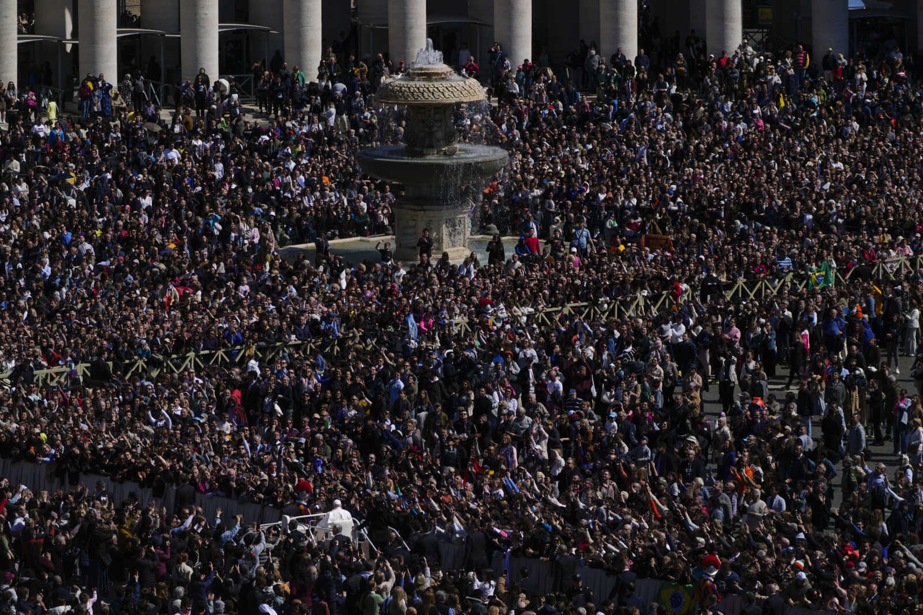 Pope Francis on the popemobile blesses the faithful Sunday in St. Peter's Square at The Vatican at the end of the Easter Sunday Mass.