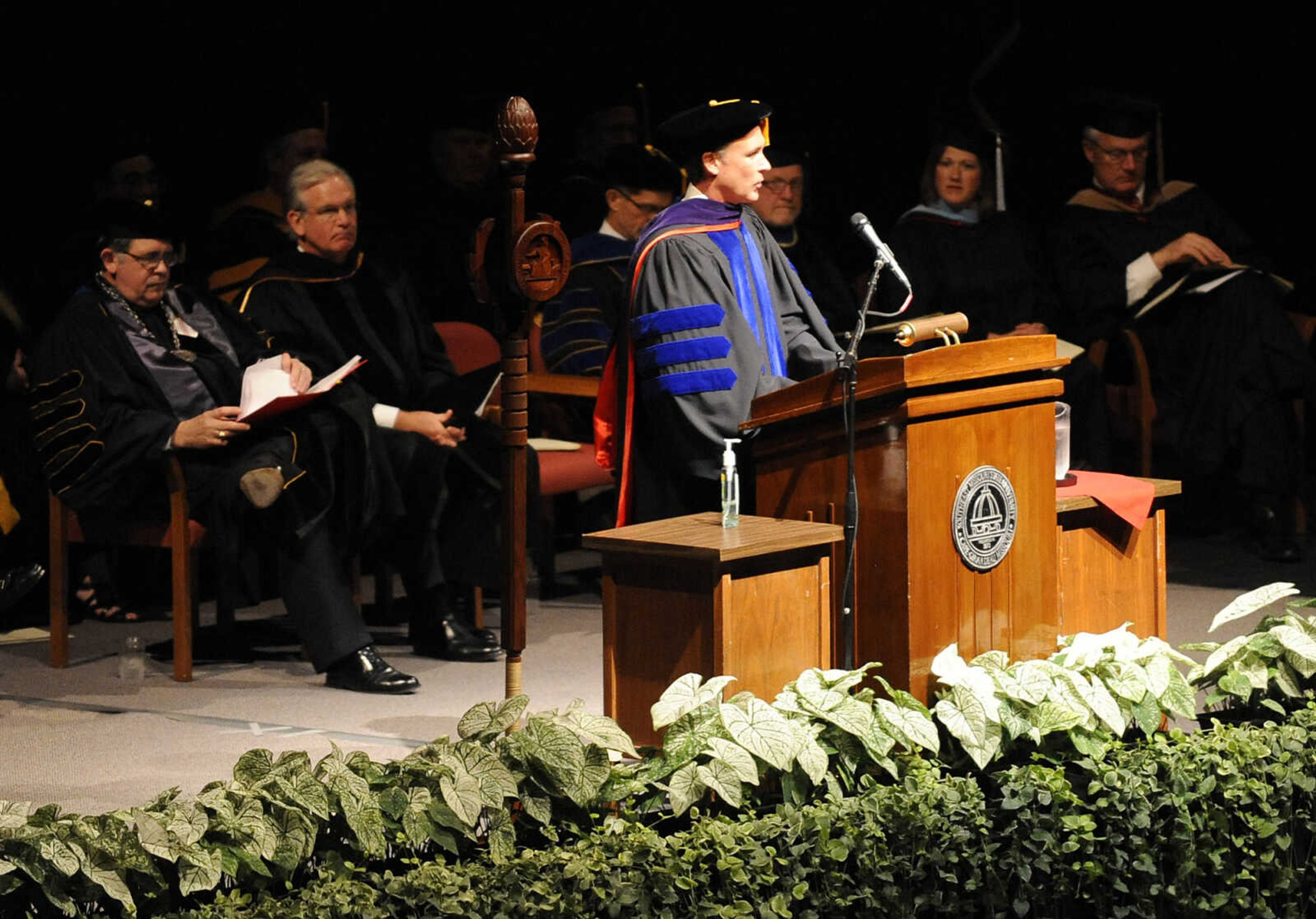 Board of Regents president Brad Bedell introduces Gov. Jay Nixon to give the commencement address during Southeast Missouri State University's 2012 Spring Commencement Exercises Saturday, May 12, at the Show Me Center.