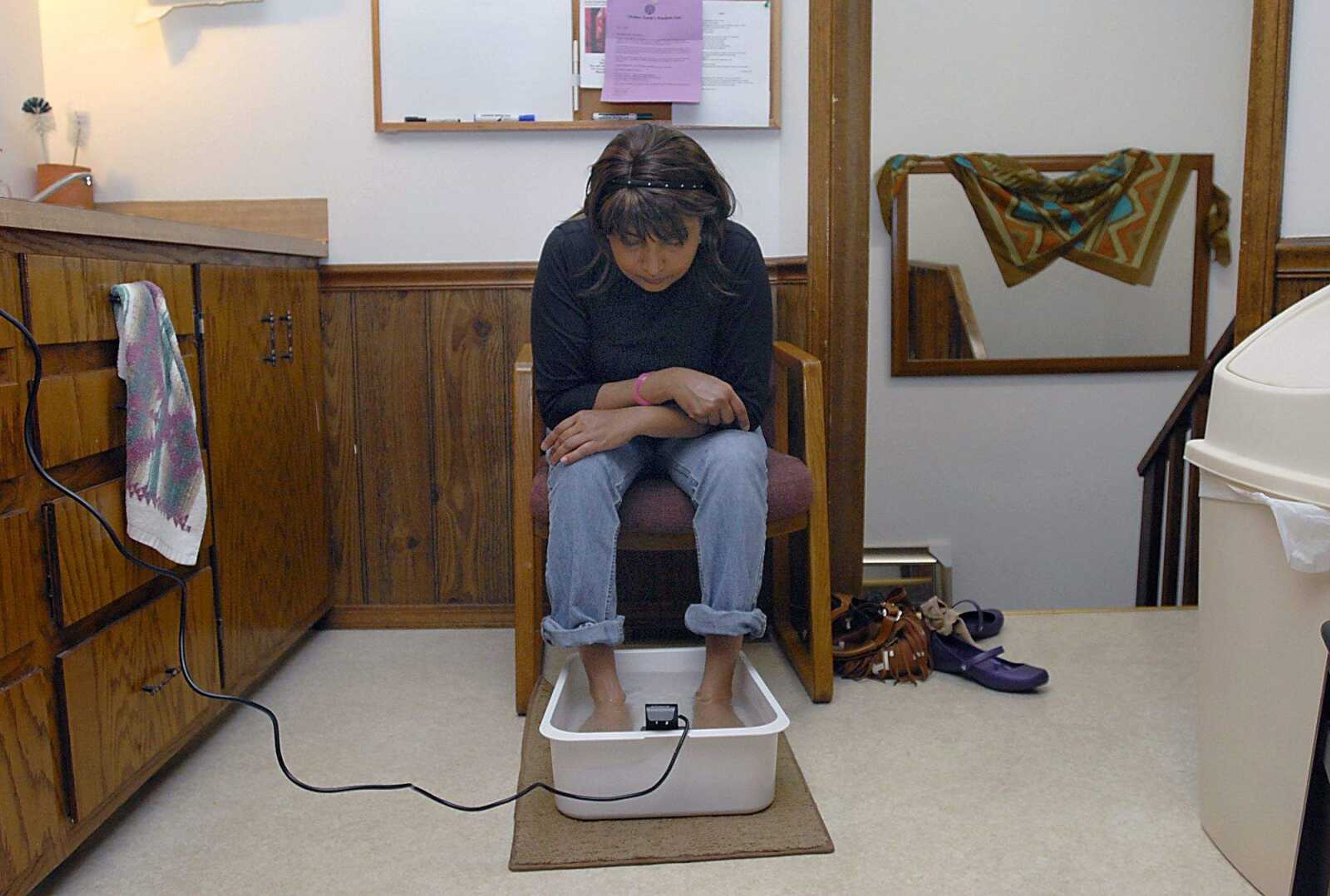 KIT DOYLE ~ kdoyle@semissourian.com
Lucky Sands watched for the water to turn murky with toxins pulled out of her system from an Ion Cleanse Monday, April 21, 2008, at the Center for Massage Therapy in Cape Girardeau. Although the procedure is expensive, said Sands, who has been unemployed for the past year and lives off of savings, it is worth it if she feels better either physically or mentally. The 43-year-old has suffered from Post Traumatic Stress Disorder since returning from Iraq in 2005.