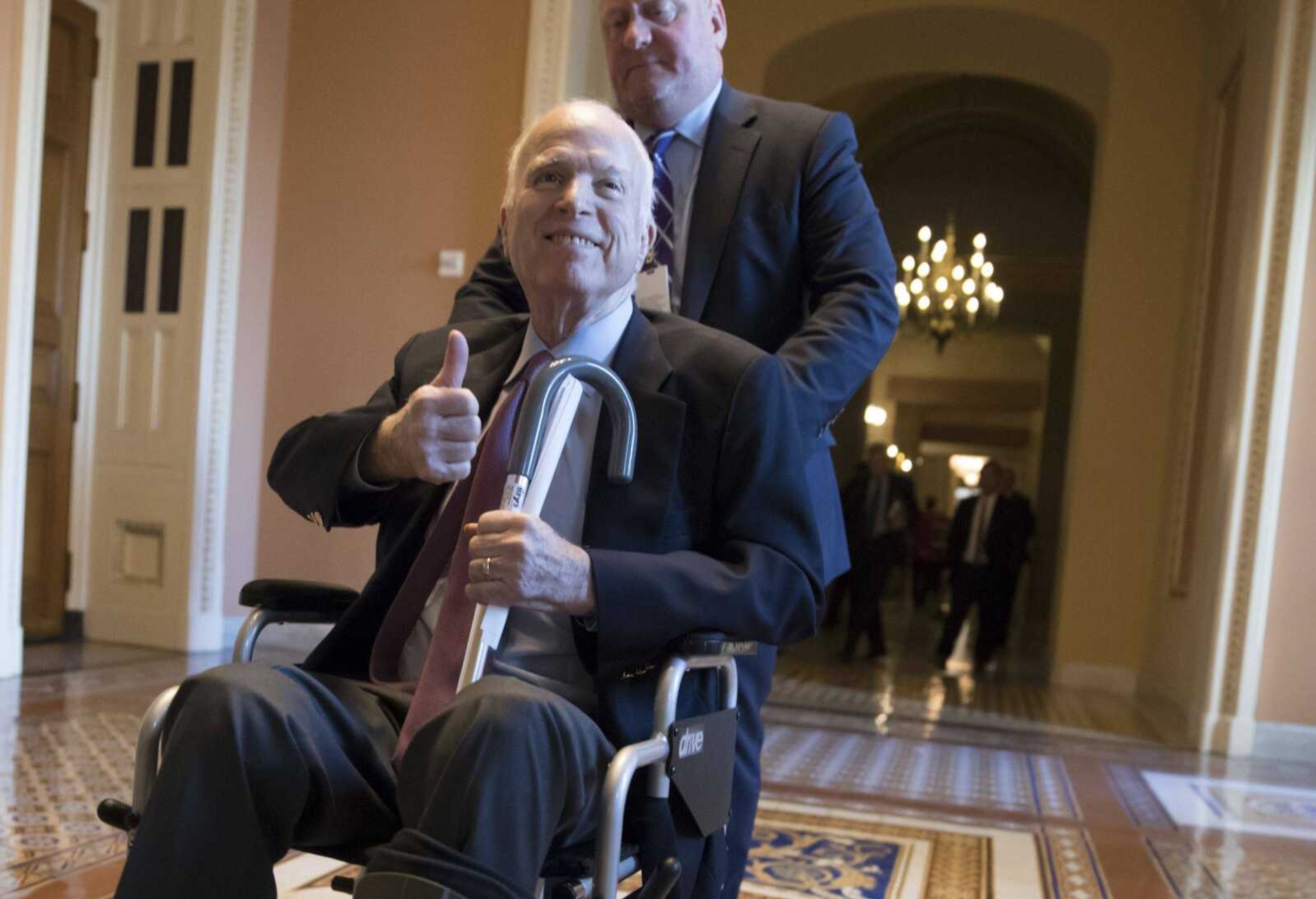 Sen. John McCain, R-Ariz., leaves a closed-door session Dec. 1 where Republican senators met on the GOP effort to overhaul the tax code in Washington.