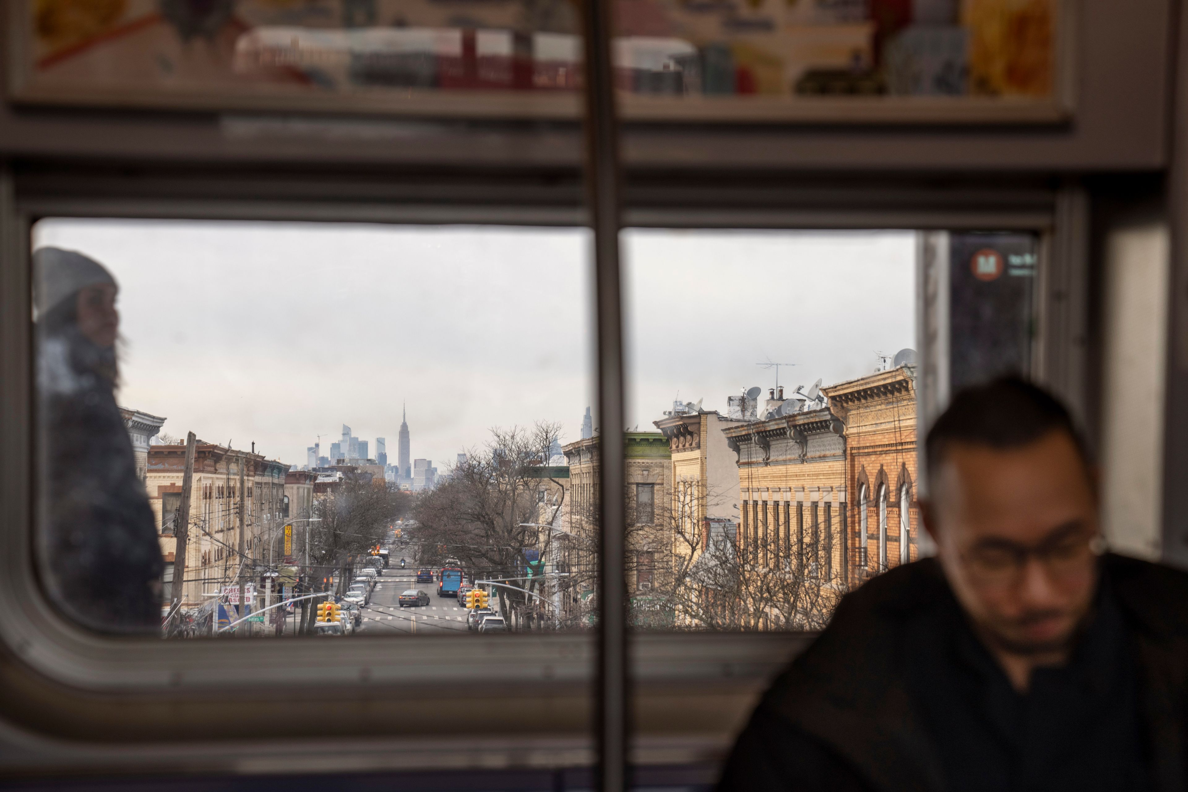 Robert Calabretta rides the subway Thursday, Feb. 15, 2024, in New York, with the Empire State Building in the background. (AP Photo/David Goldman)