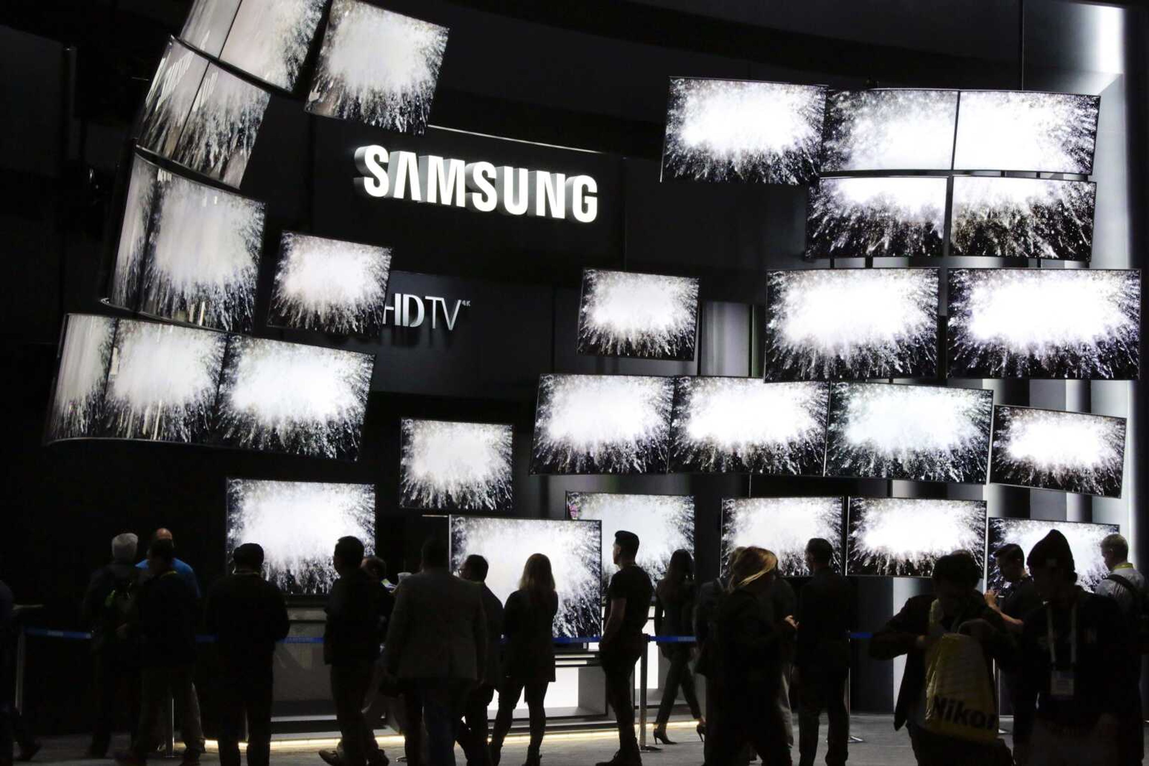 Attendees watch a presentation at a Samsung booth at last year's International CES in Las Vegas. (Jae C. Hong ~ Associated Press)