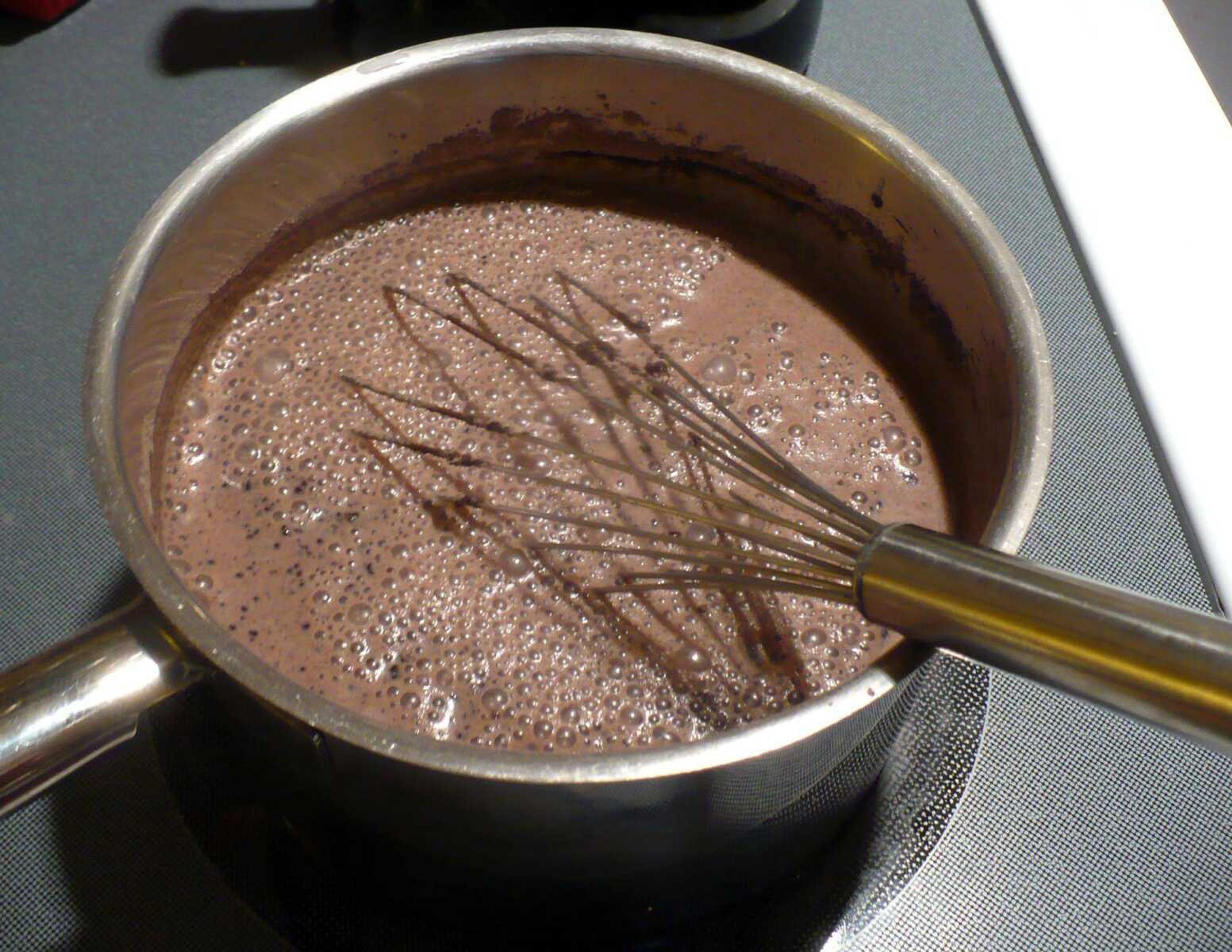 Chocolate pudding begins with milk, sugar, chocolate, eggs and cornstarch stirring on the stove. (TOM HARTE)