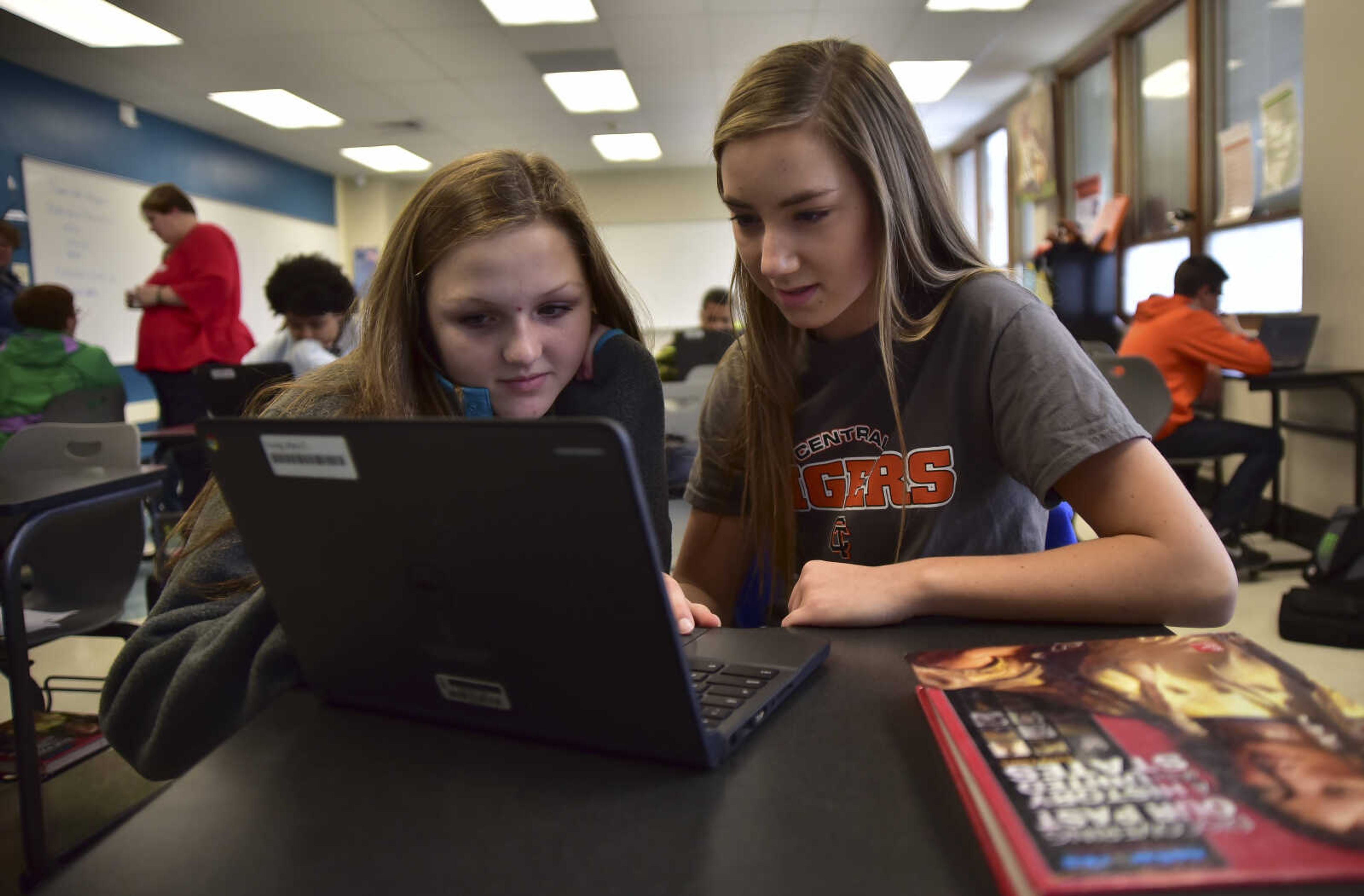 ANDREW J. WHITAKER ~ awhitaker@semissourian.com
"This is my first time doing something like this, it's nice to give our input since we can't go out and vote." Mary Katherine Young, right, said as she sits next to her classmate Sarah McKinley Davis, left, while they vote on their laptops for a mock election Tuesday, Nov. 8, 2016 at Cape Central Junior High School in Cape Girardeau.