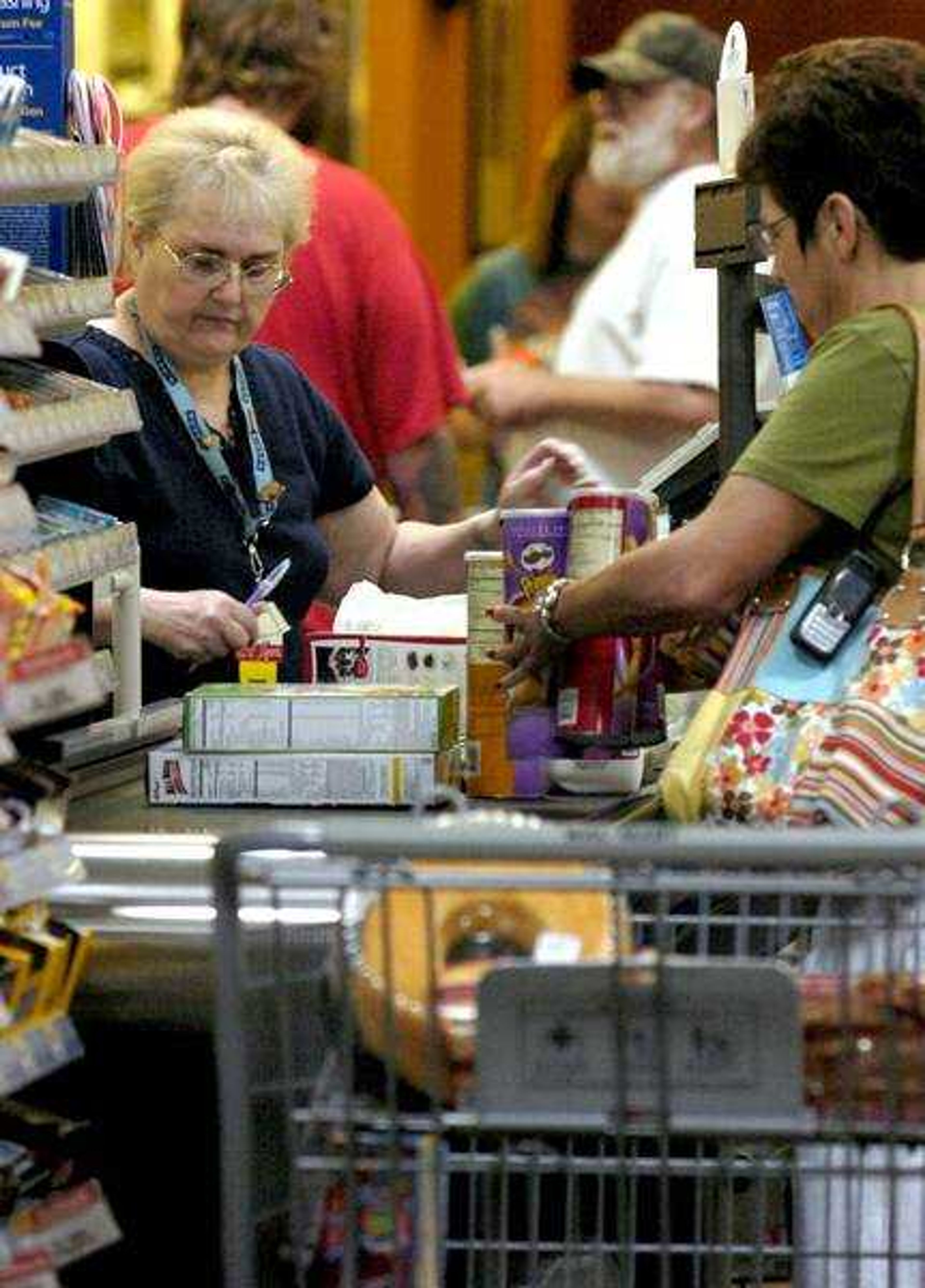 April L. Brown ~ Associated Press
 A customer checked out June 5 at Wal-Mart in Rogers, Ark. The Labor Department reported Wednesday that consumer prices jumped 1.1 percent last month, much worse than had been expected.