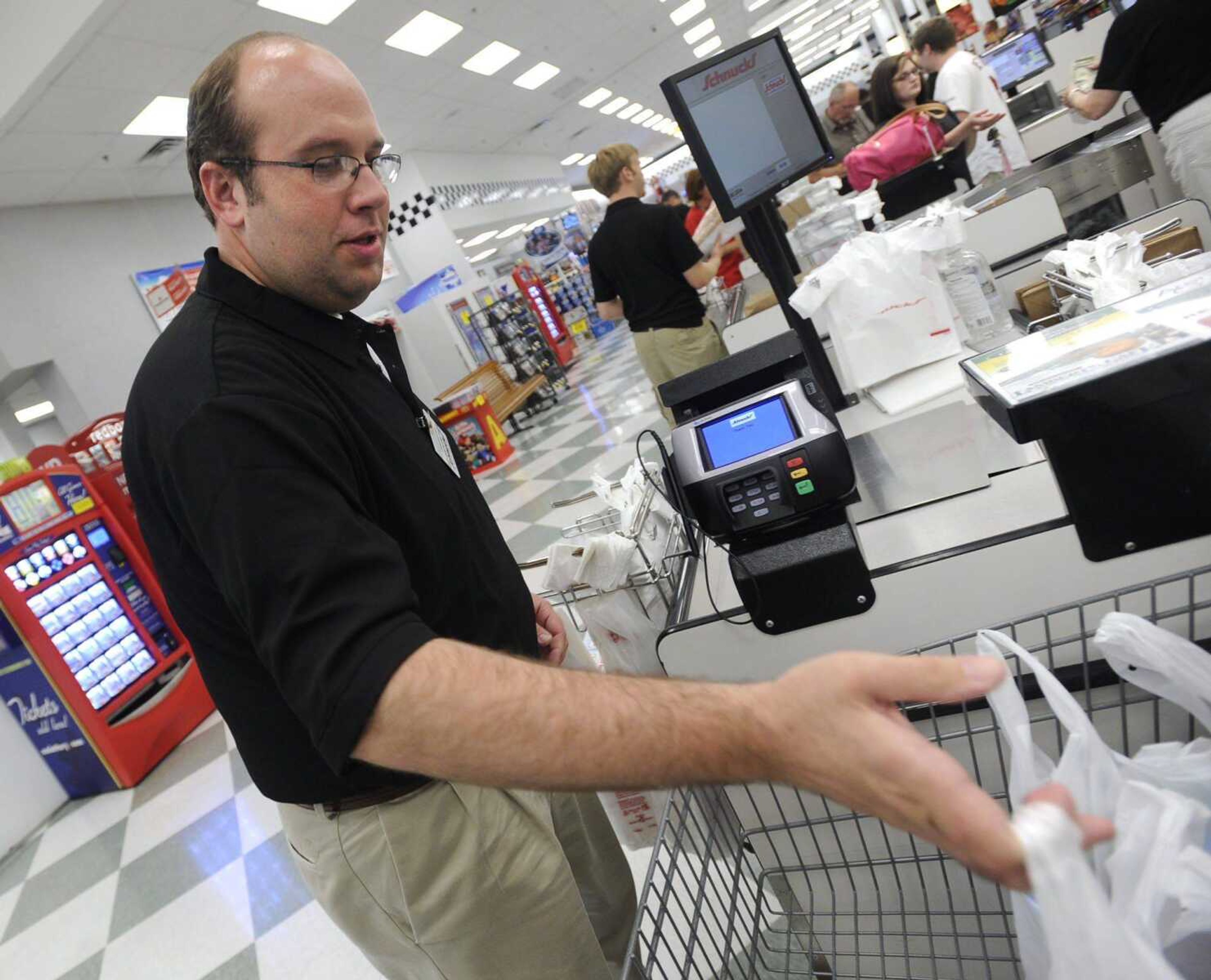 U.S. Rep. Jason Smith bags groceries Monday for customers at Schnucks in Cape Girardeau to kick off his &#8220;work a day&#8221; series. (Fred Lynch)