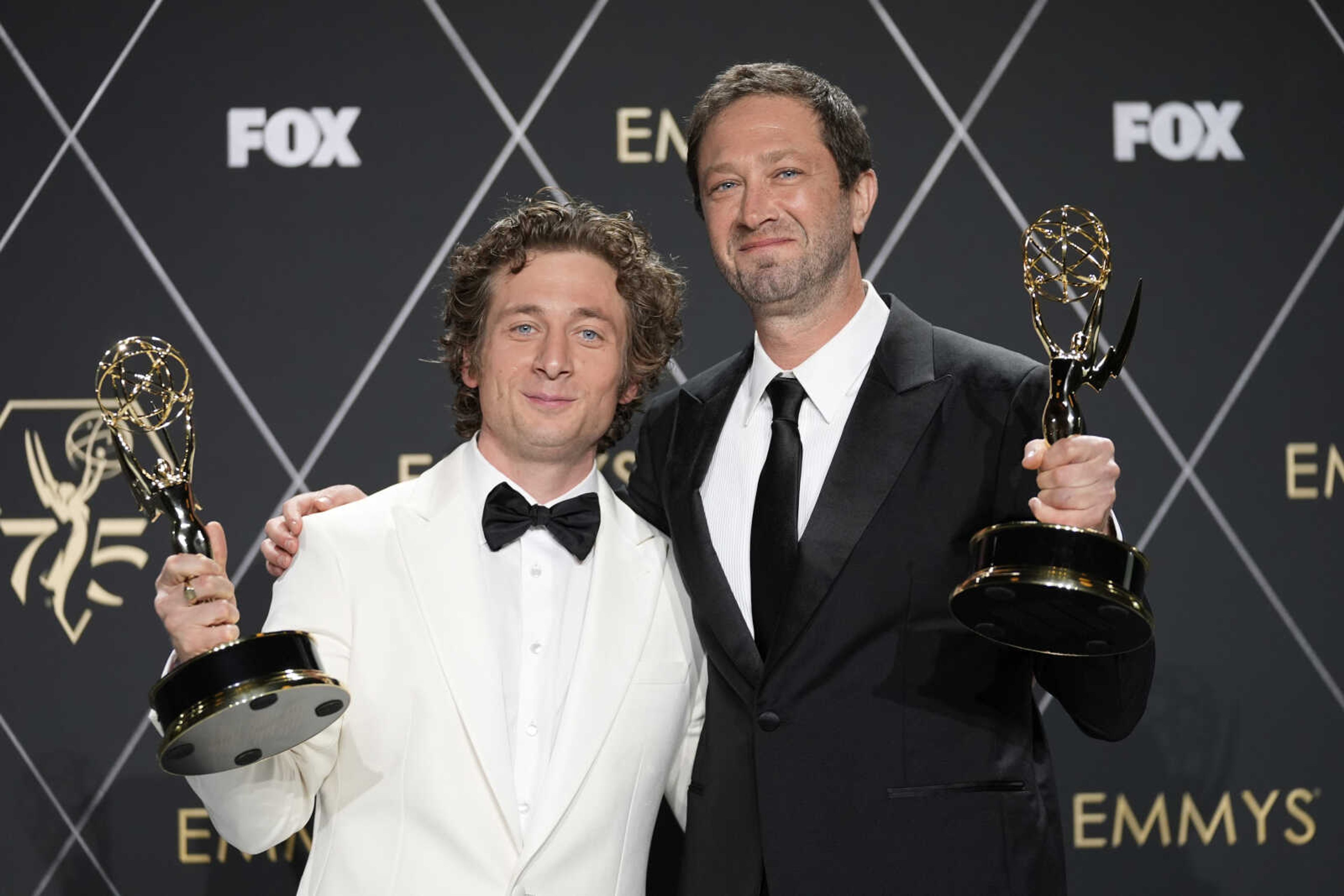 Jeremy Allen White, winner of the award for outstanding lead actor in a comedy series for "The Bear", left, and Ebon Moss-Bachrach, winner of the award for outstanding supporting actor in a comedy series for "The Bear", pose in the press room during the 75th Primetime Emmy Awards on Monday at the Peacock Theater in Los Angeles.