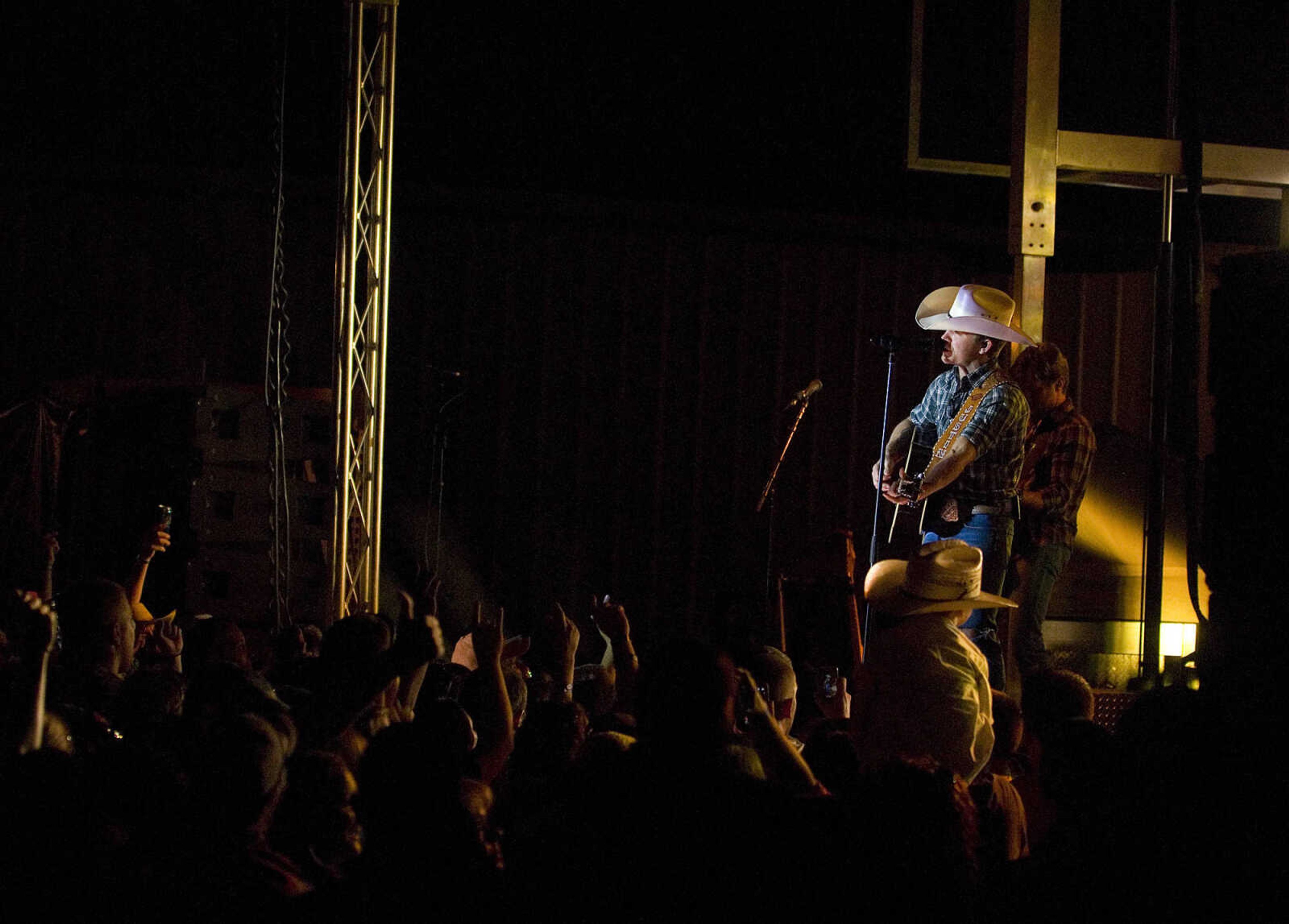 AARON EISENHAUER ~ photos@semissourian.com

Country music star Justin Moore performs for fans on the outdoor stage at Bootheel Harley-Davidson on Friday, July 12, 2013 in Scott City.