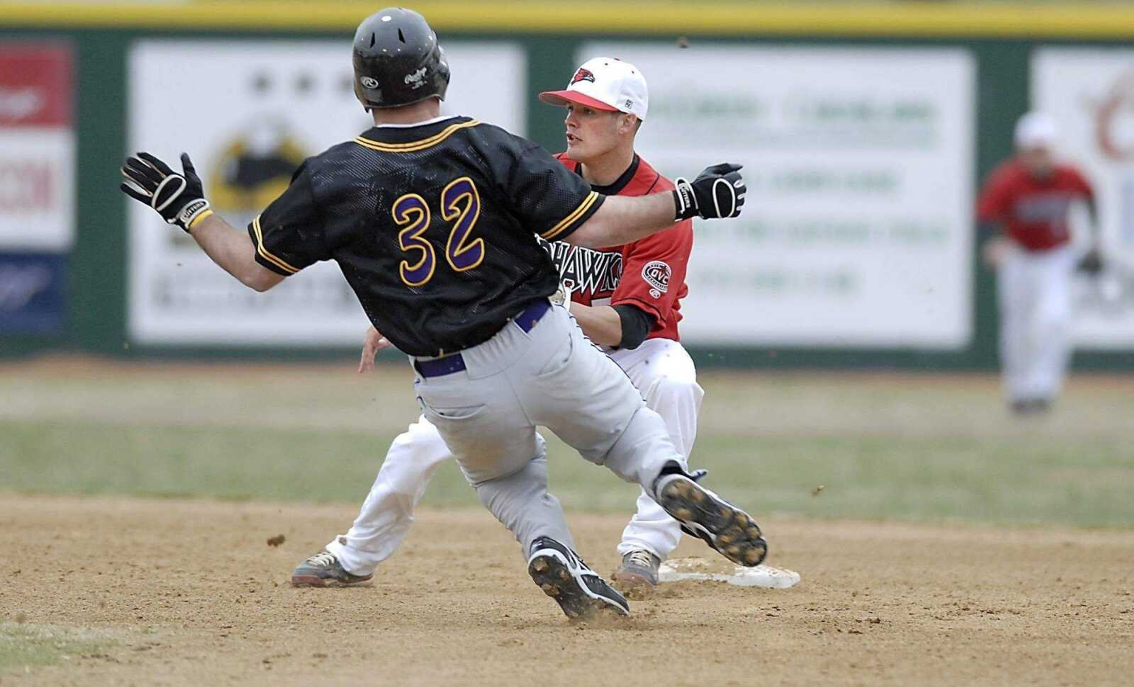 KIT DOYLE ~ kdoyle@semissourian.comSoutheast second baseman Tony Spencer covers second base on a steal attempt by a St. Catharine runner earlier this month at Capaha Field.