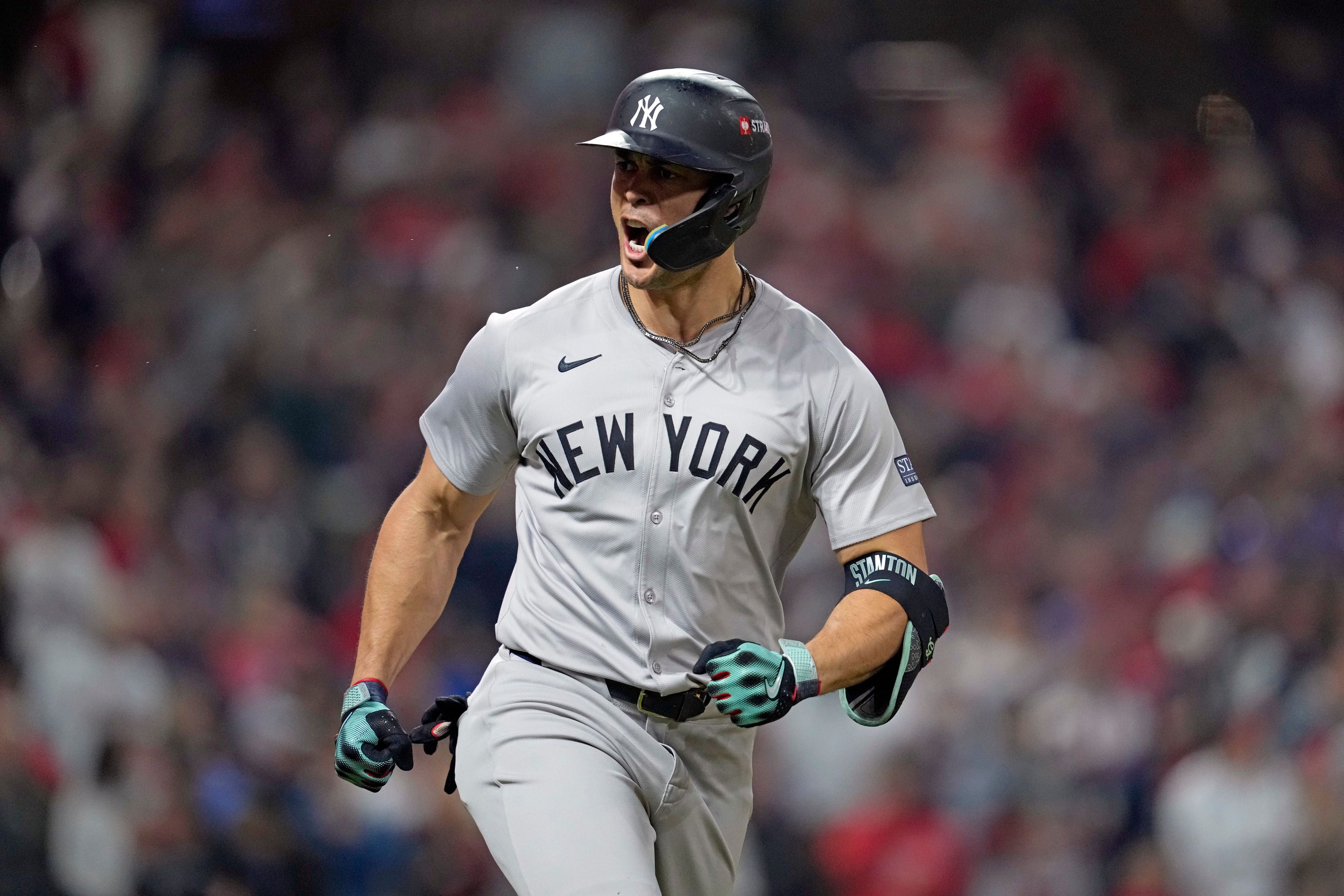 New York Yankees' Giancarlo Stanton celebrates after hitting a two-run home run against the Cleveland Guardians during the sixth inning in Game 5 of the baseball AL Championship Series Saturday, Oct. 19, 2024, in Cleveland. (AP Photo/Godofredo A. Vásquez)