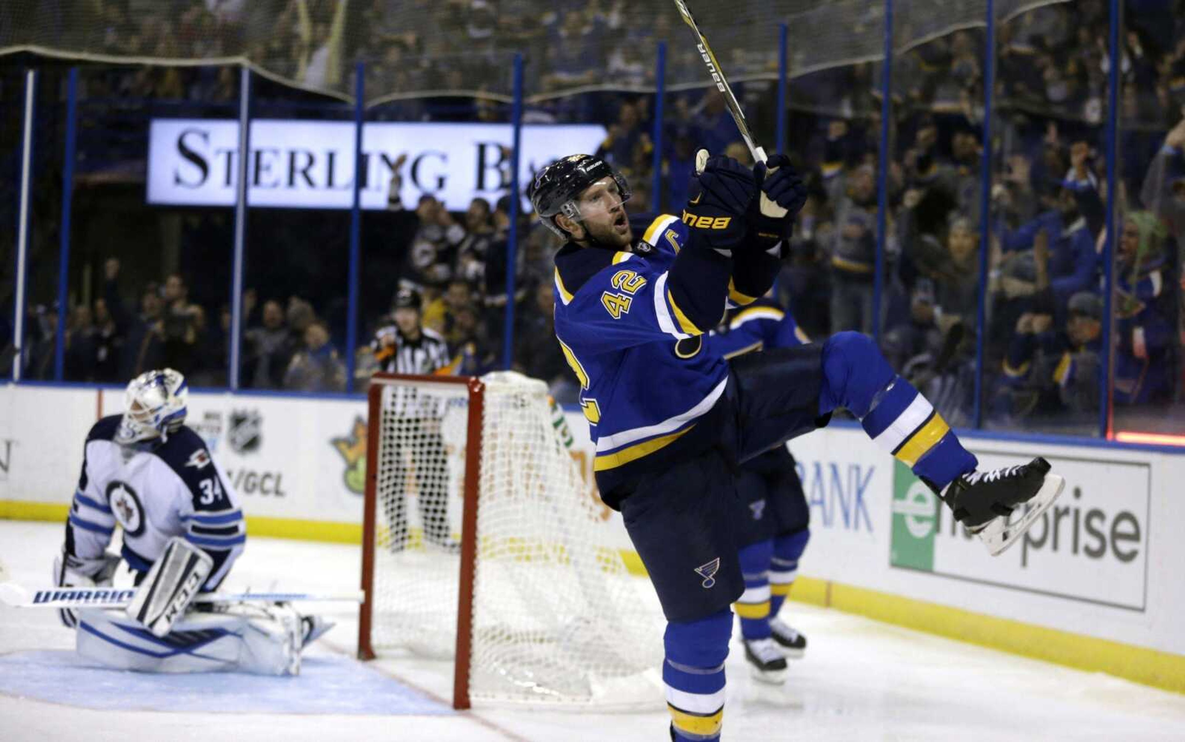 The Blues' David Backes celebrates after scoring past Jets goalie Michael Hutchinson during the second period Monday in St. Louis. Backes' goal broke a 2-2 deadlock, and the Blues held on for a 3-2 victory. (Jeff Roberson ~ Associated Press)