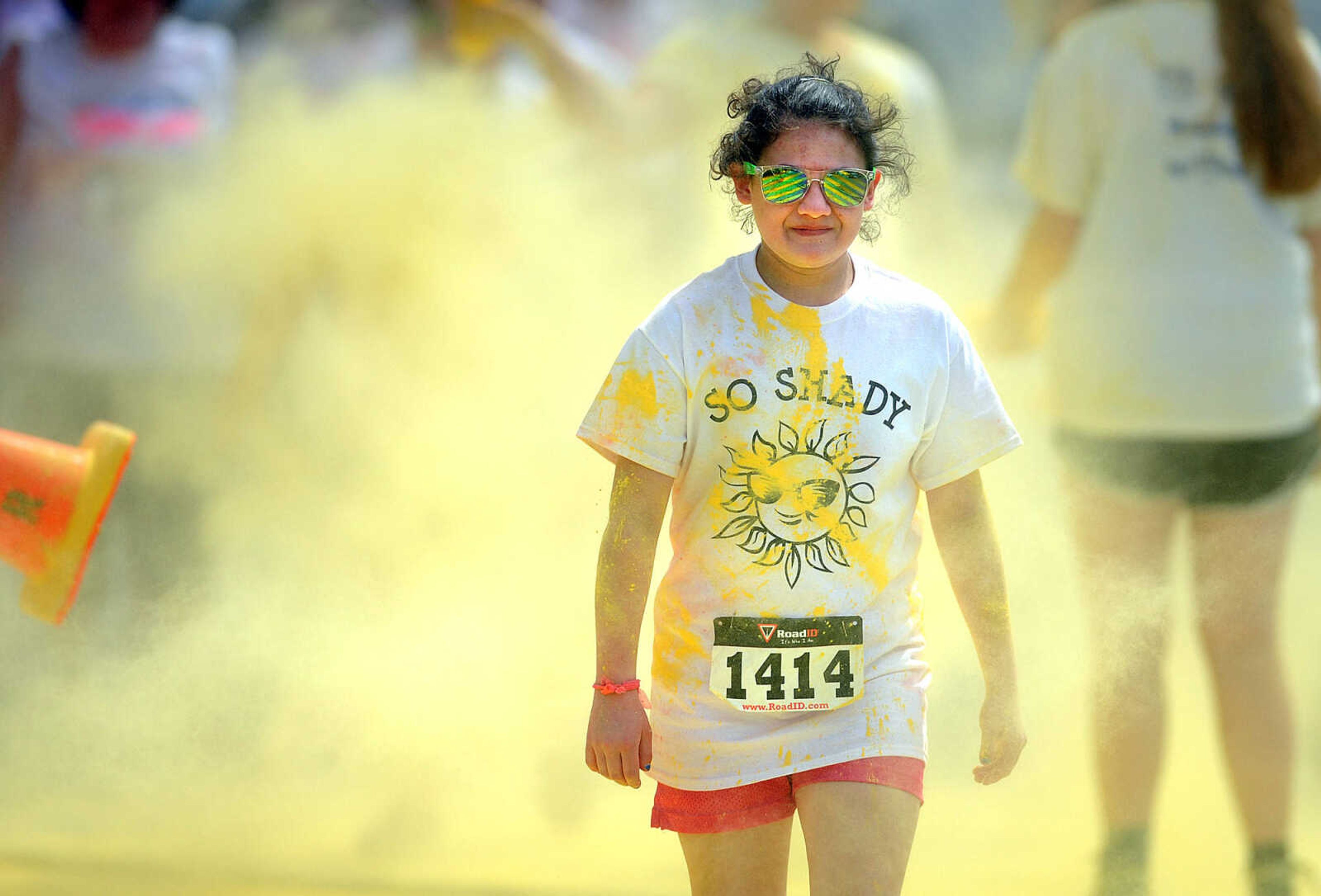 LAURA SIMON ~ lsimon@semissourian.com

Participants in the Color Me Cape 5K are sprayed with yellow powder at the second color station on Frederick Street, Saturday, April 12, 2014, in Cape Girardeau.