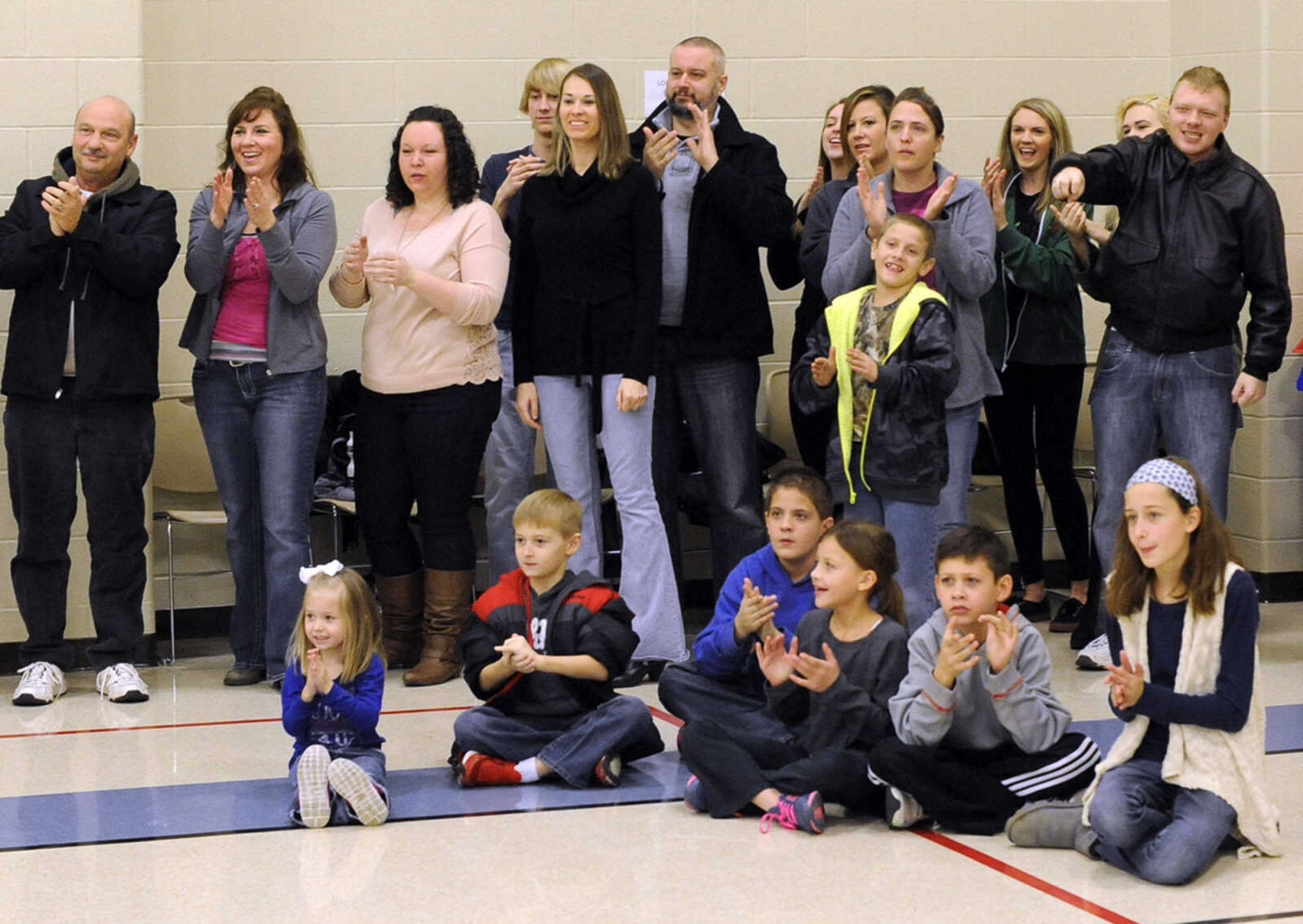 Some of the extras cheer during filming of the movie, "Love Chronicles (of the Cape)" on Sunday, Jan. 11, 2015 at Shawnee Park Center in Cape Girardeau.