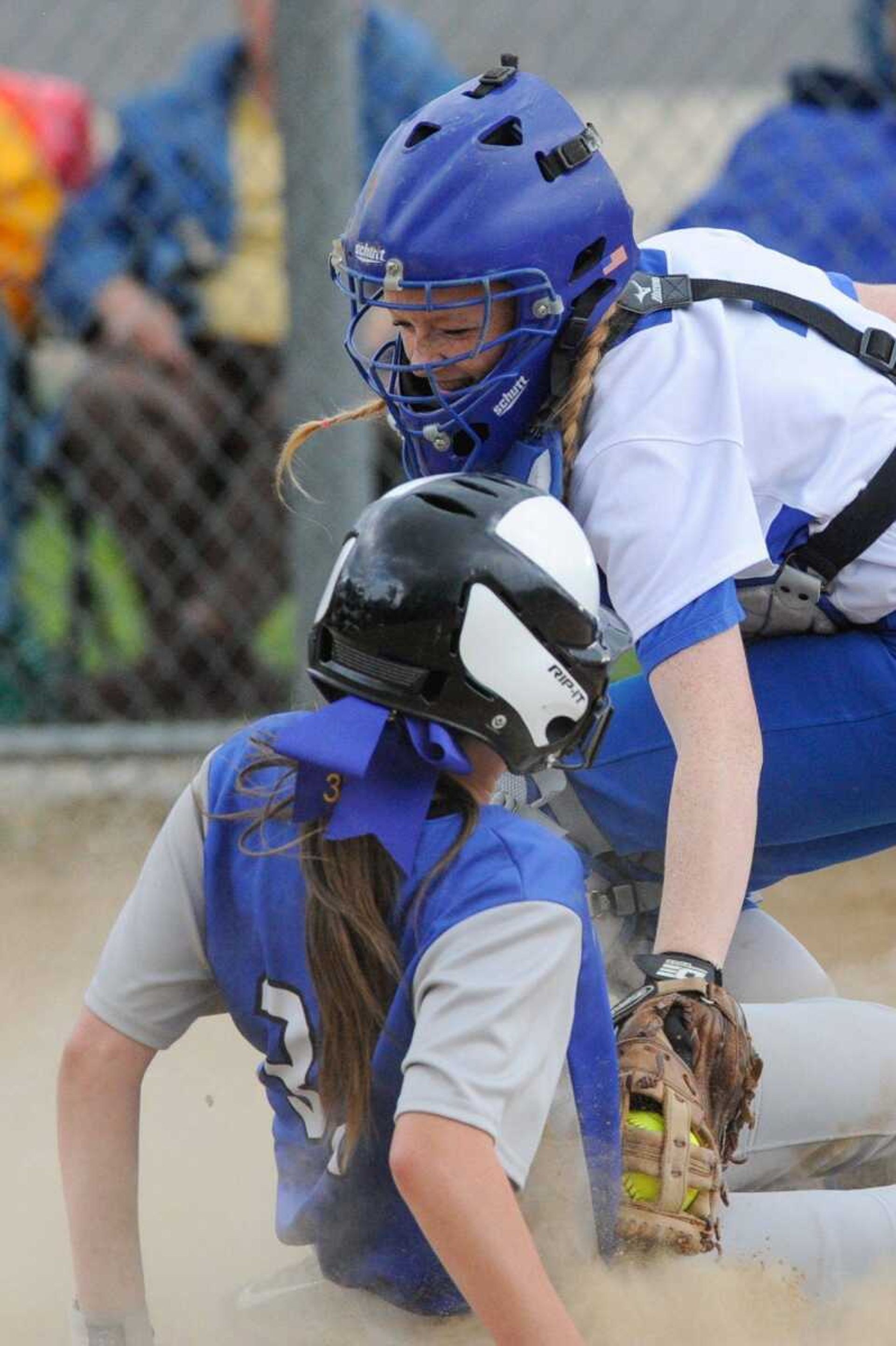 Oran's Leah Cauble slides into home plate to score past Leopold's Patience Vandermierden in the second inning during a Class 1 District 4 semifinal Tuesday, May 3, 2016 in Marble Hill, Missouri.