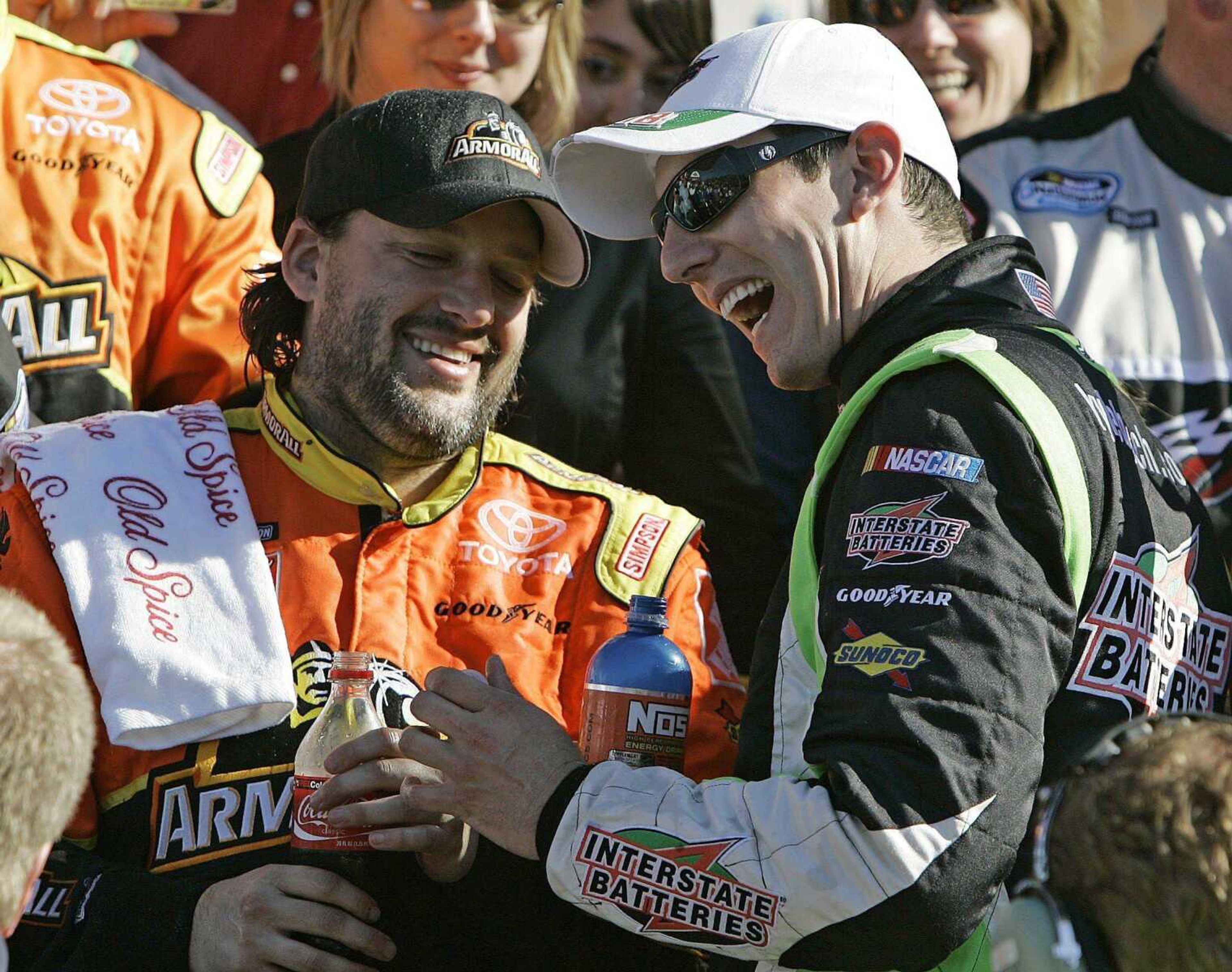 Teammates Tony Stewart, left, and Kyle Busch celebrated after Stewart's victory Saturday in the NASCAR Nationwide Series race at Daytona International Speedway in Daytona Beach, Fla. (JOHN RAOUX ~ Associated Press)