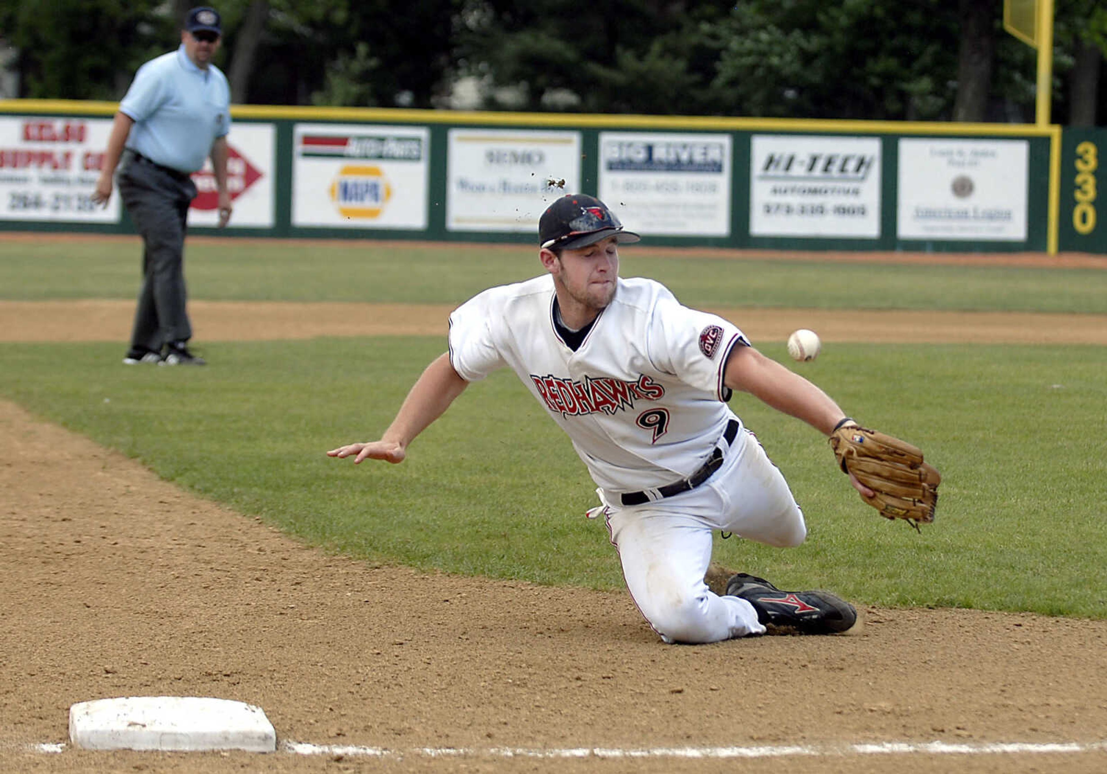 KIT DOYLE ~ kdoyle@semissourian.com
Third baseman Trenton Moses can't pull in a hard grounder down the line Friday, May 15, 2009, at Capaha Field.