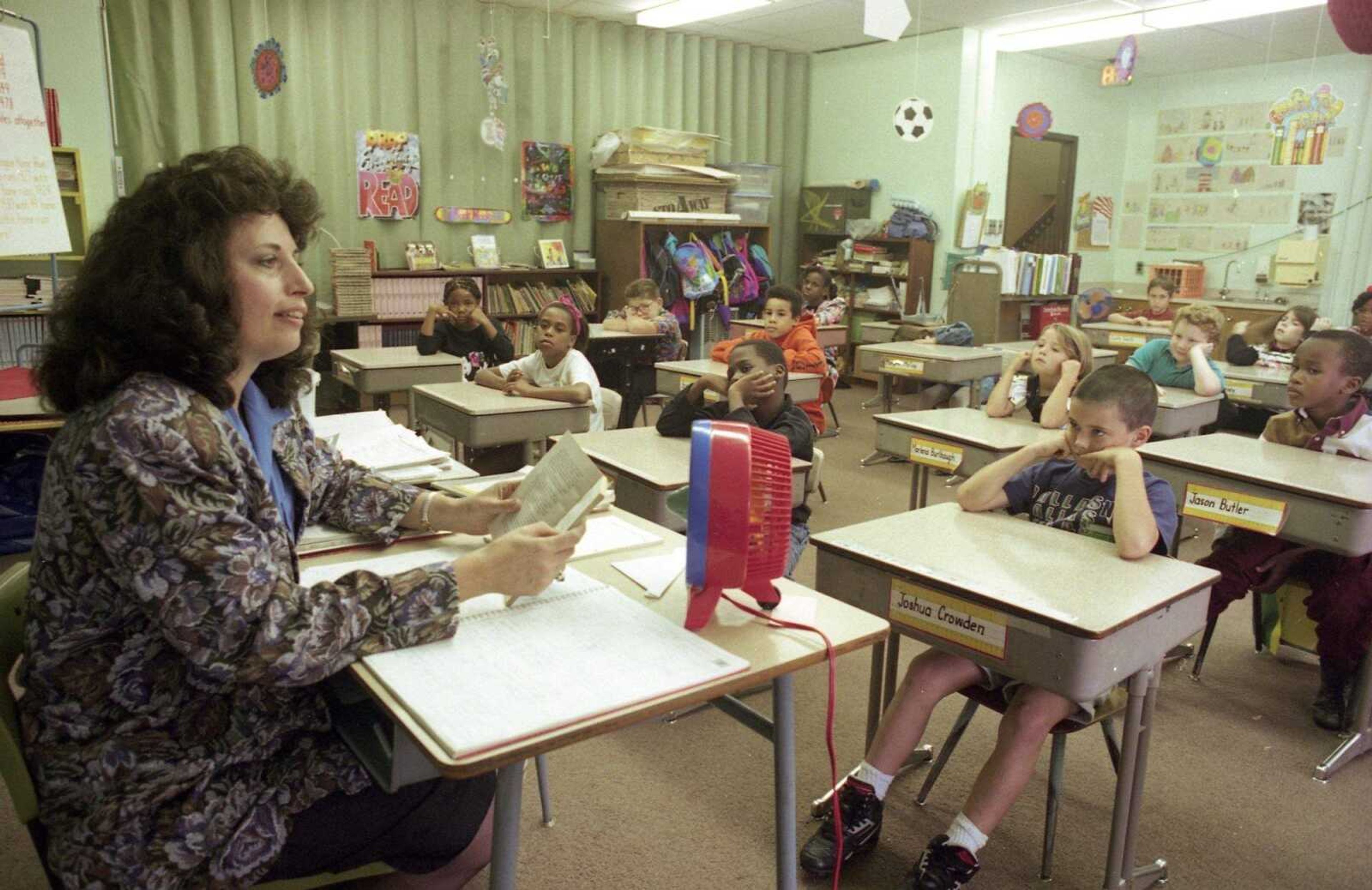 Sept. 26, 1993
Karen Doyle reads to her 28 third-grade students at Washington School. If voters approve a new middle school for the district Oct. 5, it would open up more teaching and storage space at Washington.