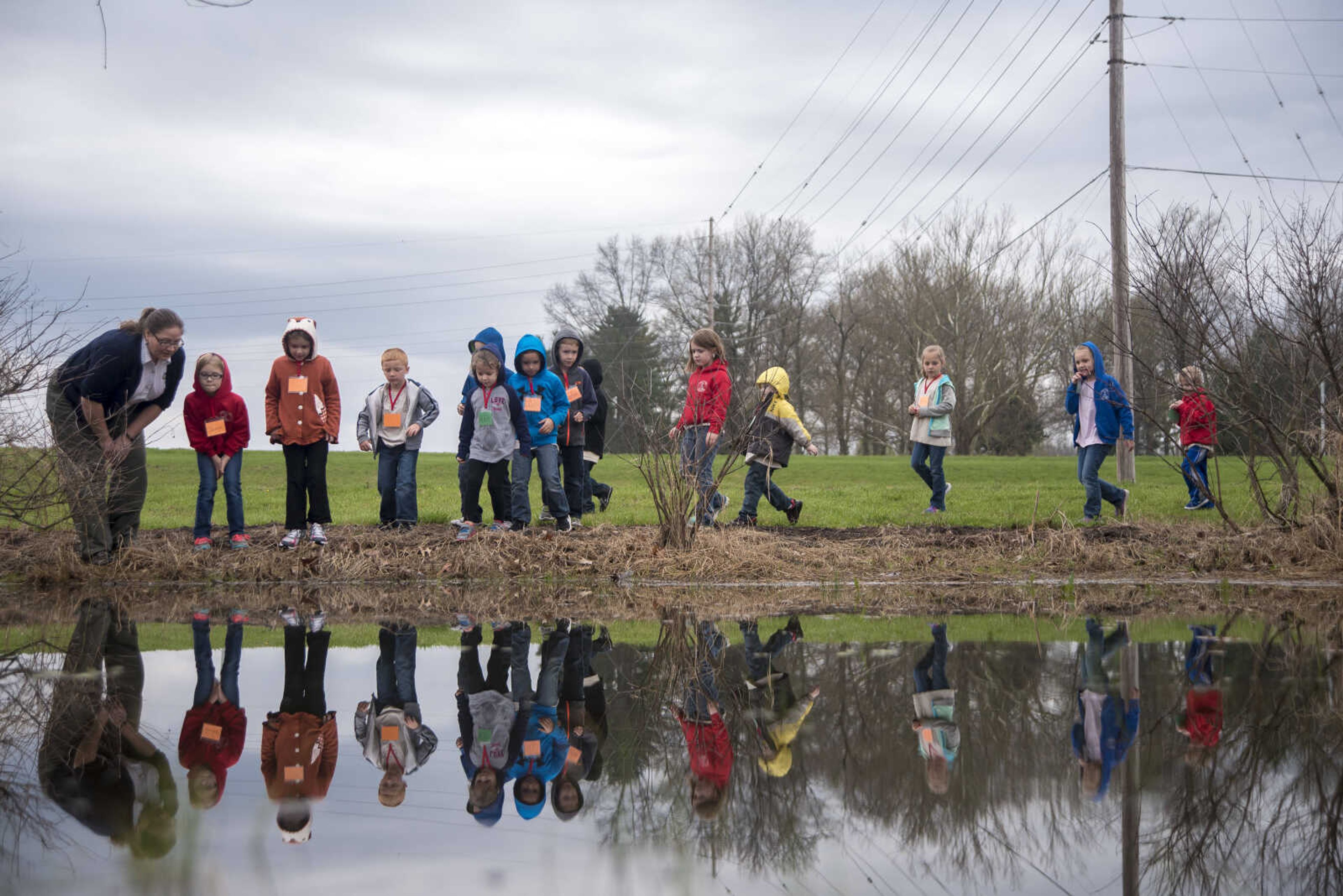 Jordi Brostoski talks to students about a frog's life cycle at the Cape Girardeau Conservation Nature Center Wednesday, March 29, 2017 in Cape Girardeau.