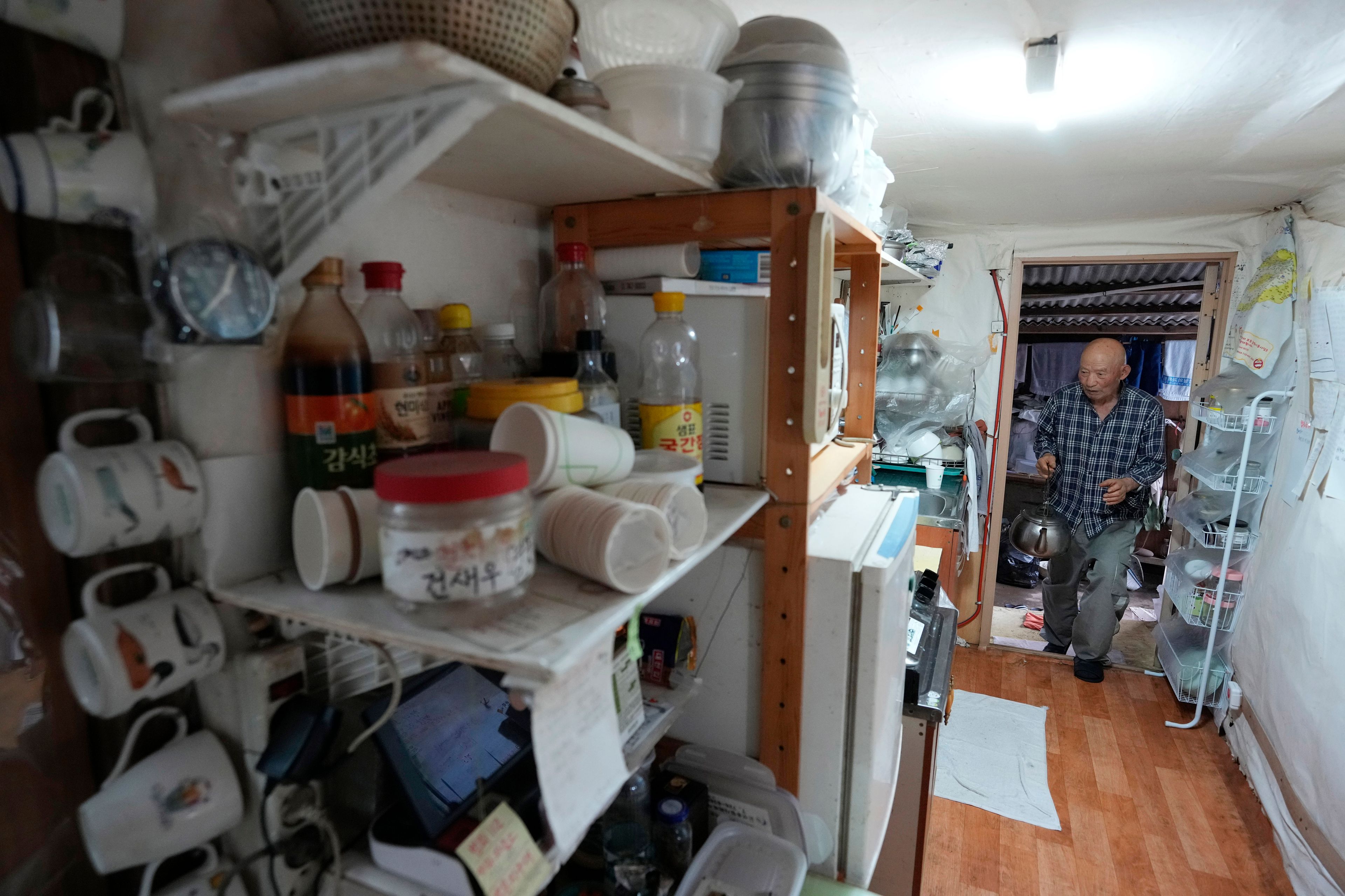 Park Jong-kyun works at his house on Jeju Island, South Korea, Wednesday, Feb. 21, 2024. Park had posted on a message board that he was looking for his twin girls relinquished for adoption sometime between 1973 and 1976. The message was seen by adoptee Rebecca Kimmel who eventually helped reunite Park with his daughters in America. (AP Photo/Ahn Young-joon)