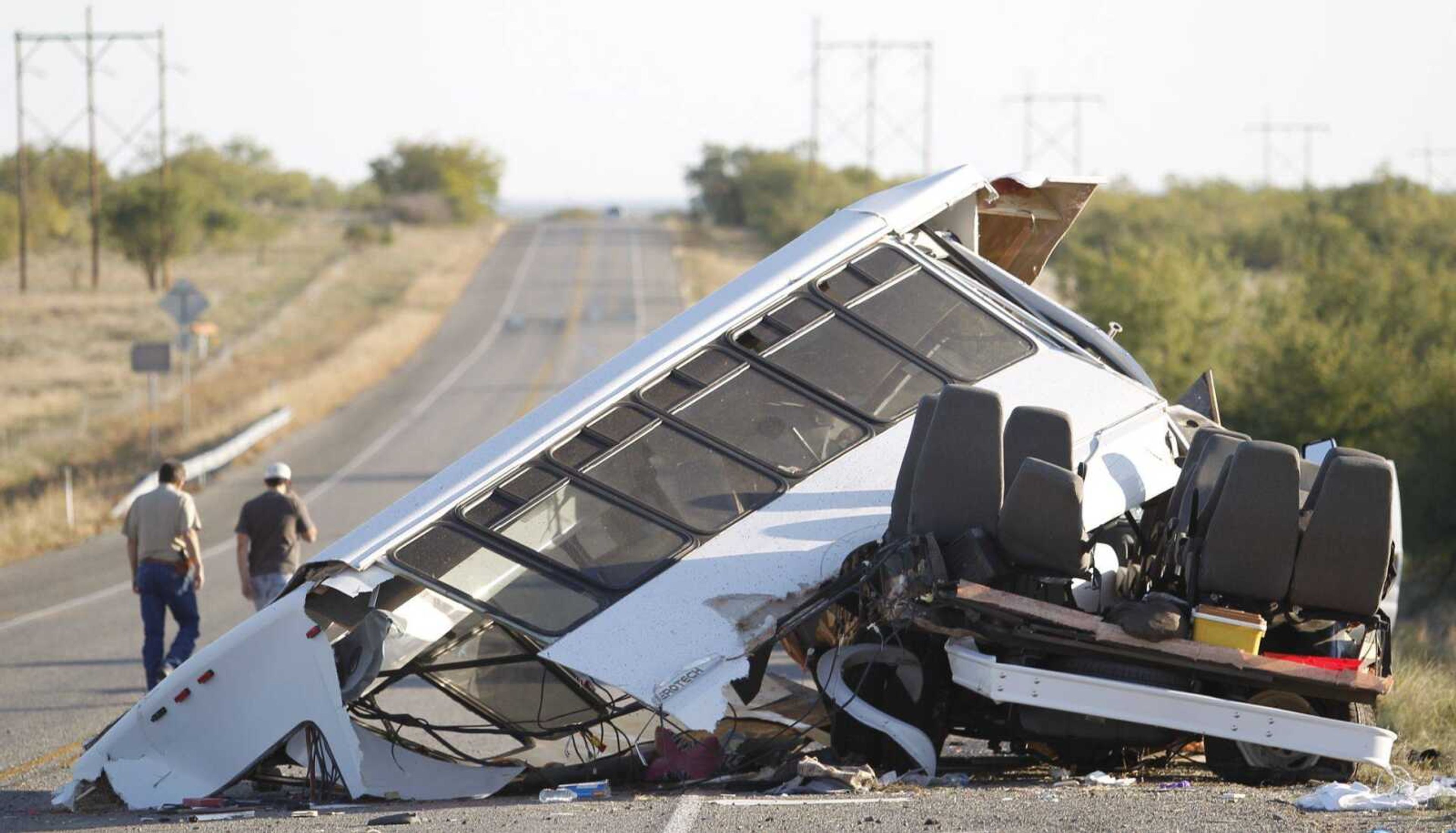 Investigators examine the scene of a bus crash Friday in Paint Rock, Texas. A bus carrying Abilene Christian University students and faculty to a children&#8217;s home for a weekend of missionary work lost control Friday and overturned, killing a 19-year-old student and sending all 15 other people onboard to hospitals, officials said. (LaKeith Kennedy ~ The San Angelo Standard-Times)