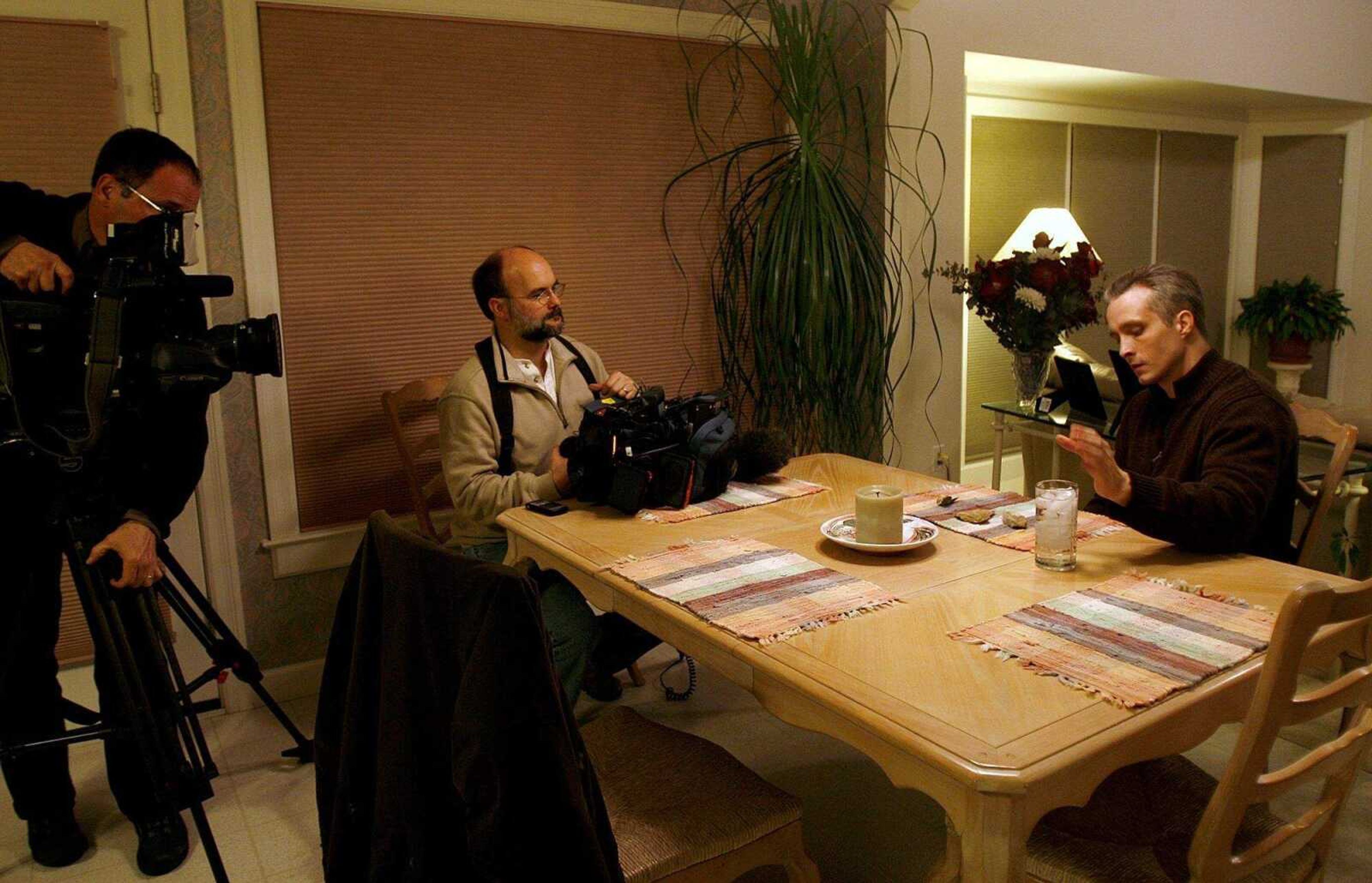 ELIZABETH DODD ~ edodd@semissourian.com
A crew from ABC News interviews Kezer at a friend's home in Columbia Wednesday night.