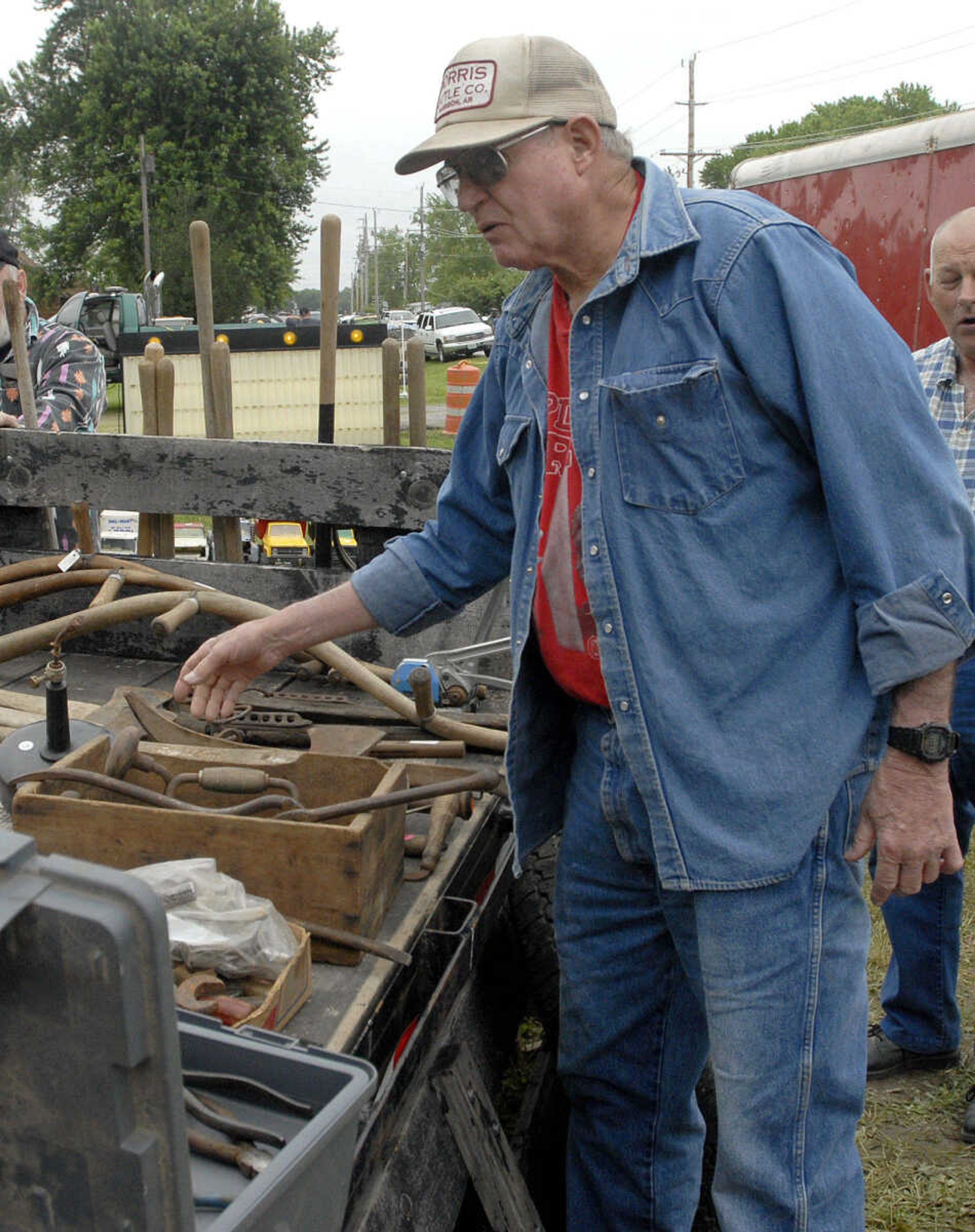 LAURA SIMON~lsimon@semissourian.com
Nolan Cox of Leslie, Ark. looks through old tools Friday, May 27, 2011 in Dutchtown during the 100-Mile Yard sale.