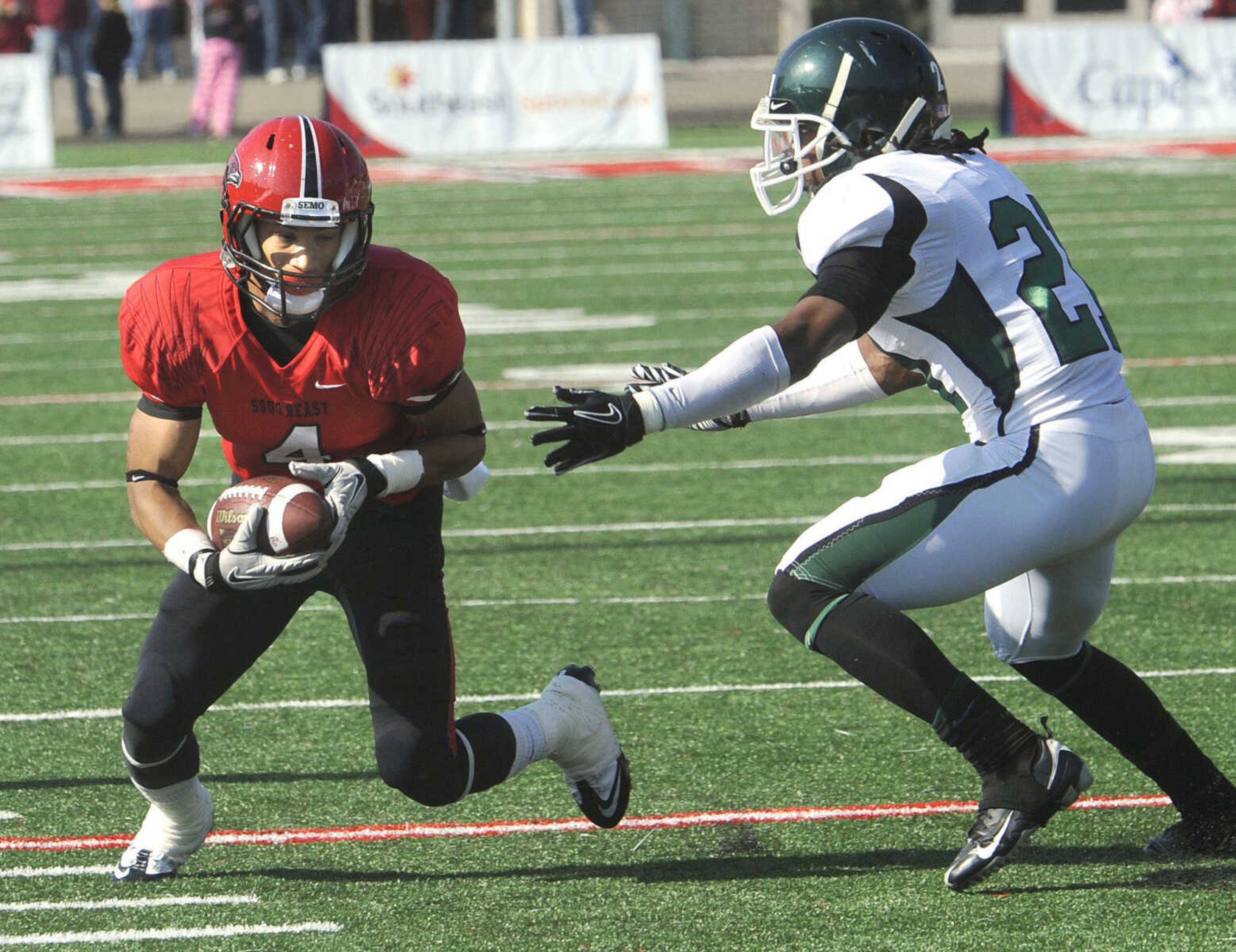 Southeast Missouri State's Spencer Davis carries the ball after a pass reception before being tackled by Central Methodist's Mitchell Swan during the second quarter Saturday, Nov. 5, 2011 at Houck Stadium. (Fred Lynch)