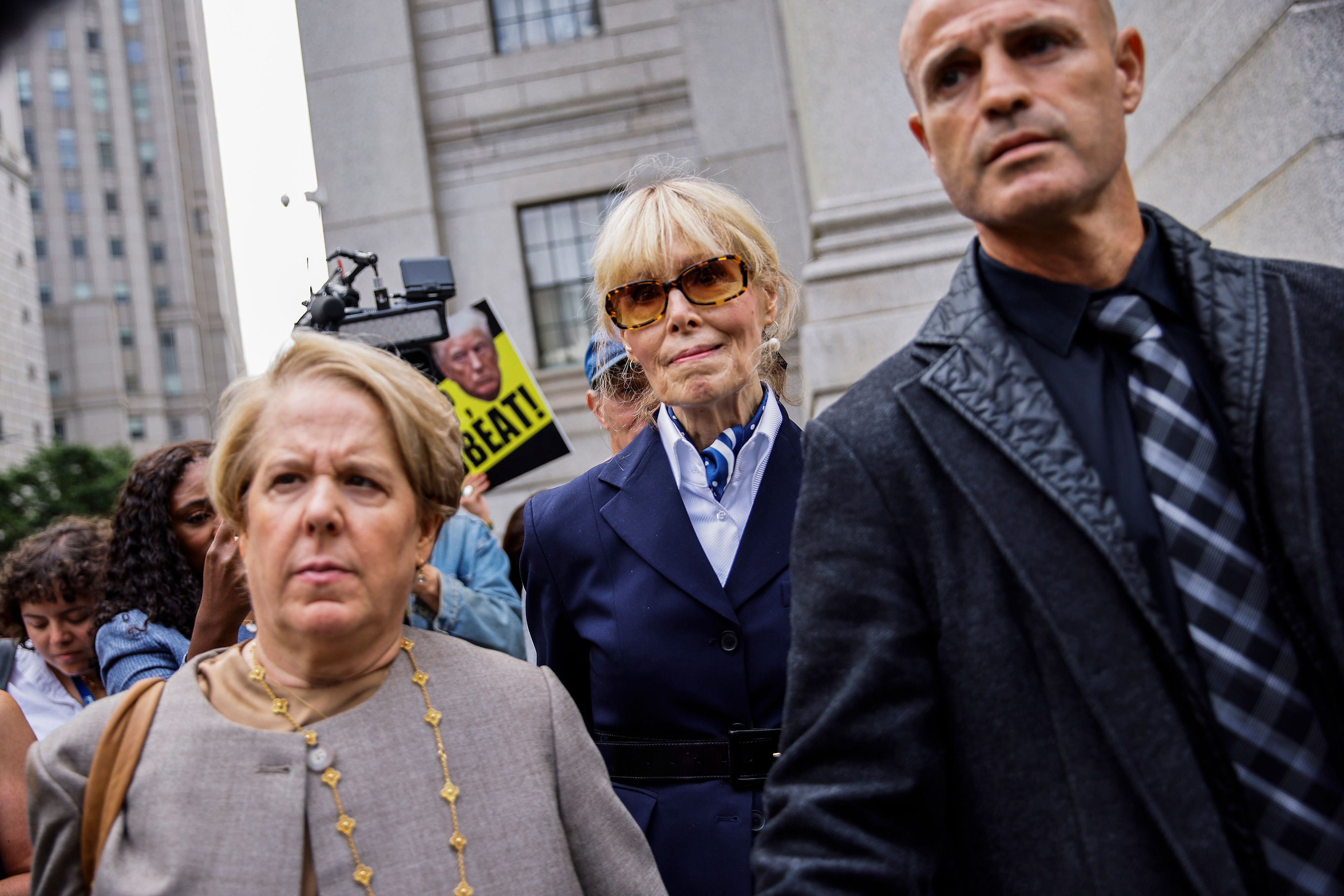 E. Jean Carroll, center, leaves Manhattan federal court with her attorney Roberta Kaplan, left, Friday, Sept. 6, 2024, in New York. (AP Photo/Eduardo Munoz Alvarez)