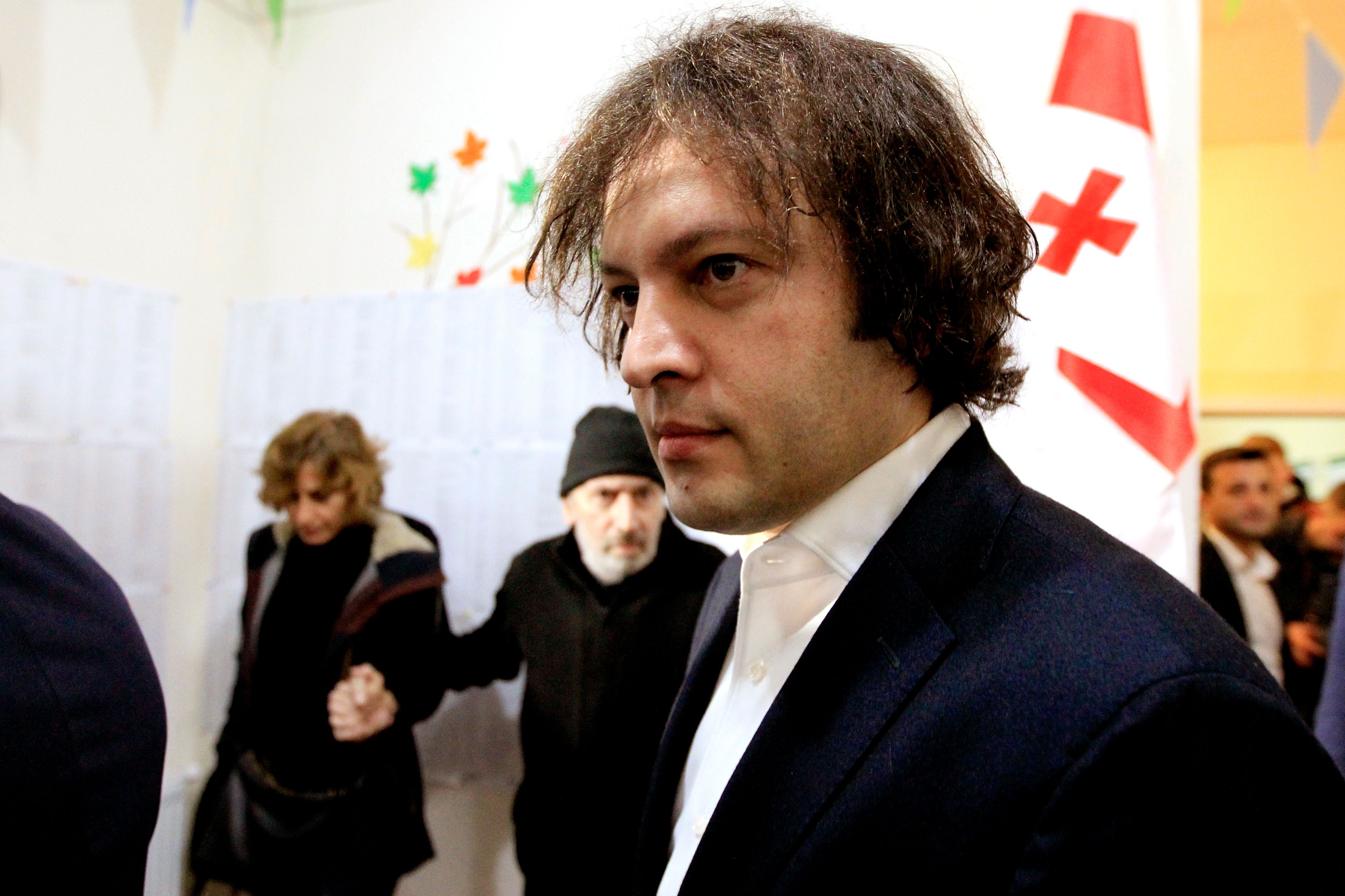 Georgian Prime Minister Irakli Kobakhidze walks after voting at a polling station during the parliamentary election in Tbilisi, Georgia, Saturday, Oct. 26, 2024. (AP Photo/Shakh Aivazov)