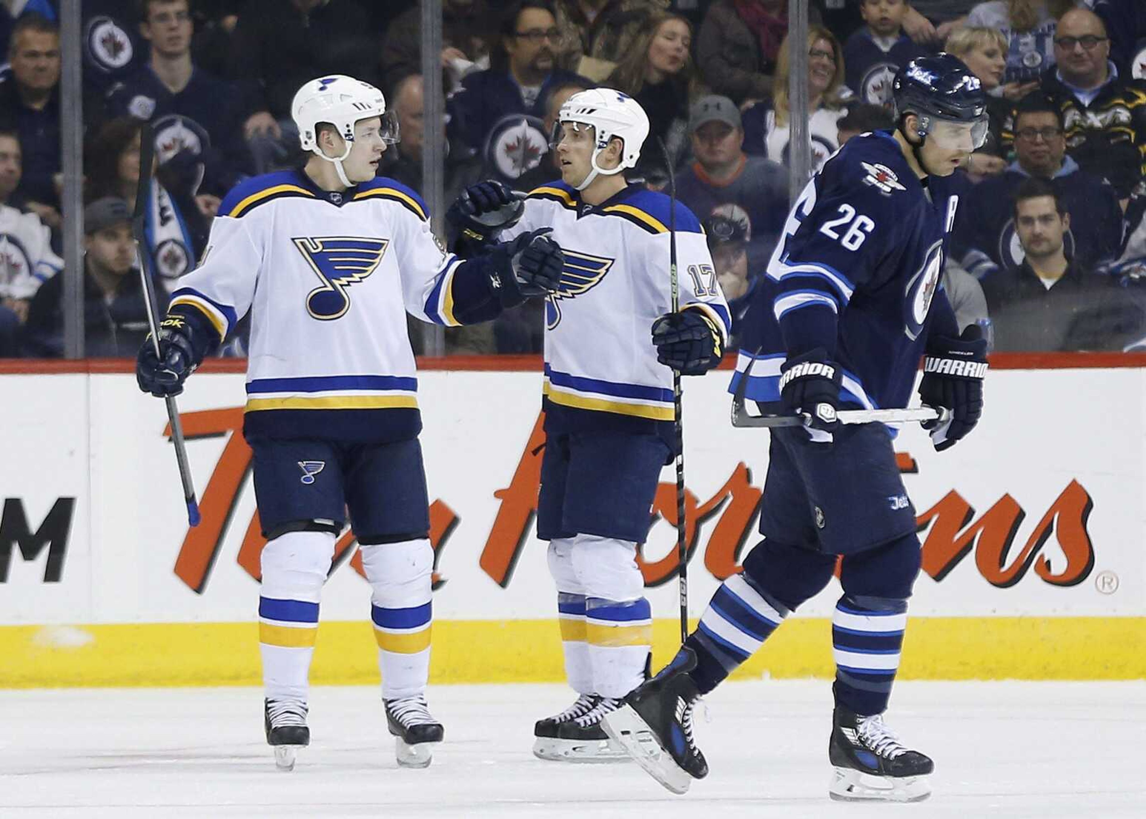 The Blues' Jaden Schwartz, left, and Vladimir Tarasenko celebrate Schwartz's goal against the Jets during second period Sunday in Winnipeg. The Blues won 4-2.