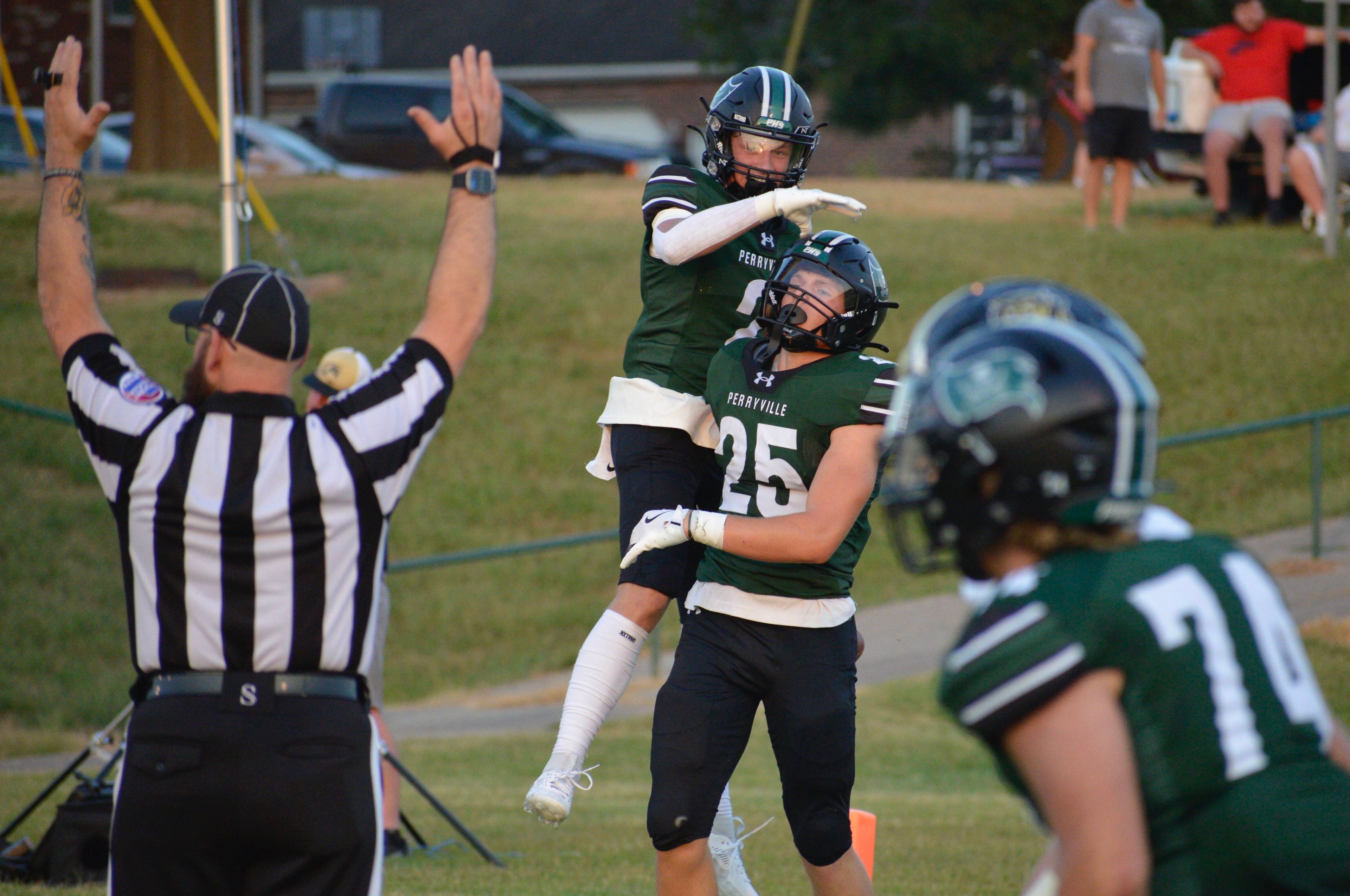 Perryville's Chase Richardet celebrates with running back Drew Lueckel after scoring a touchdown against Fredericktown on Thursday, Aug. 29, in Perryville, Mo.