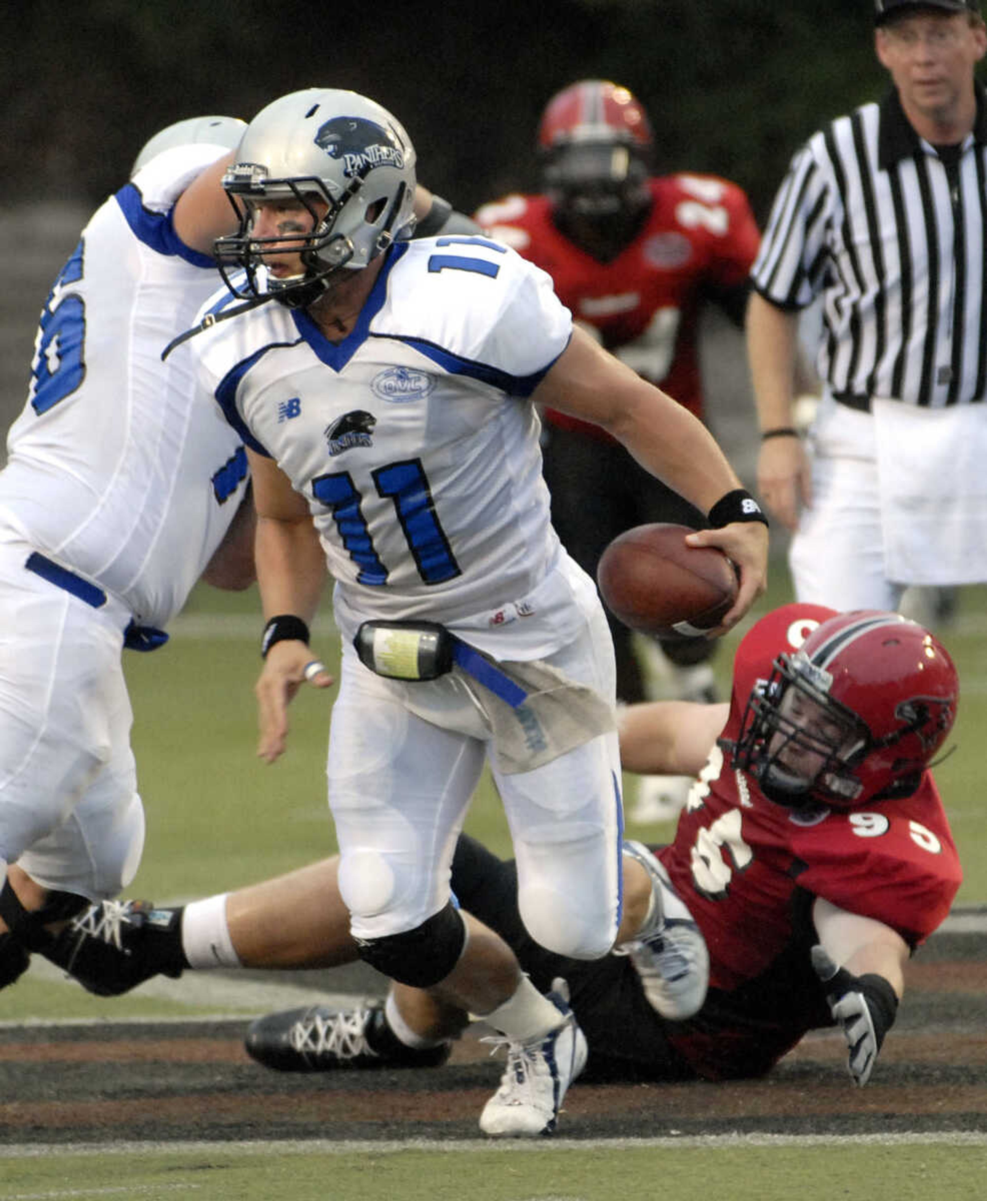 FRED LYNCH ~ flynch@semissourian.com
Eastern Illinois quarterback Jake Christensen escapes being tackled by Southeast Missouri State's Josh Gipson during the first quarter Saturday at Houck Stadium.