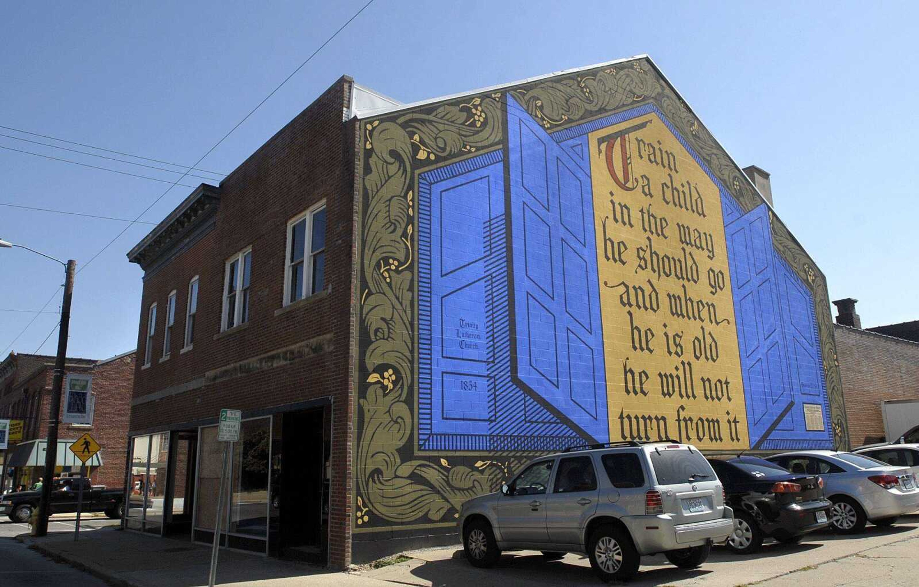 The building at 501 Broadway was recently bought by Trinity Lutheran Church. Earlier this month, the church got a permit to demolish the two-story brick structure. (Laura Simon)