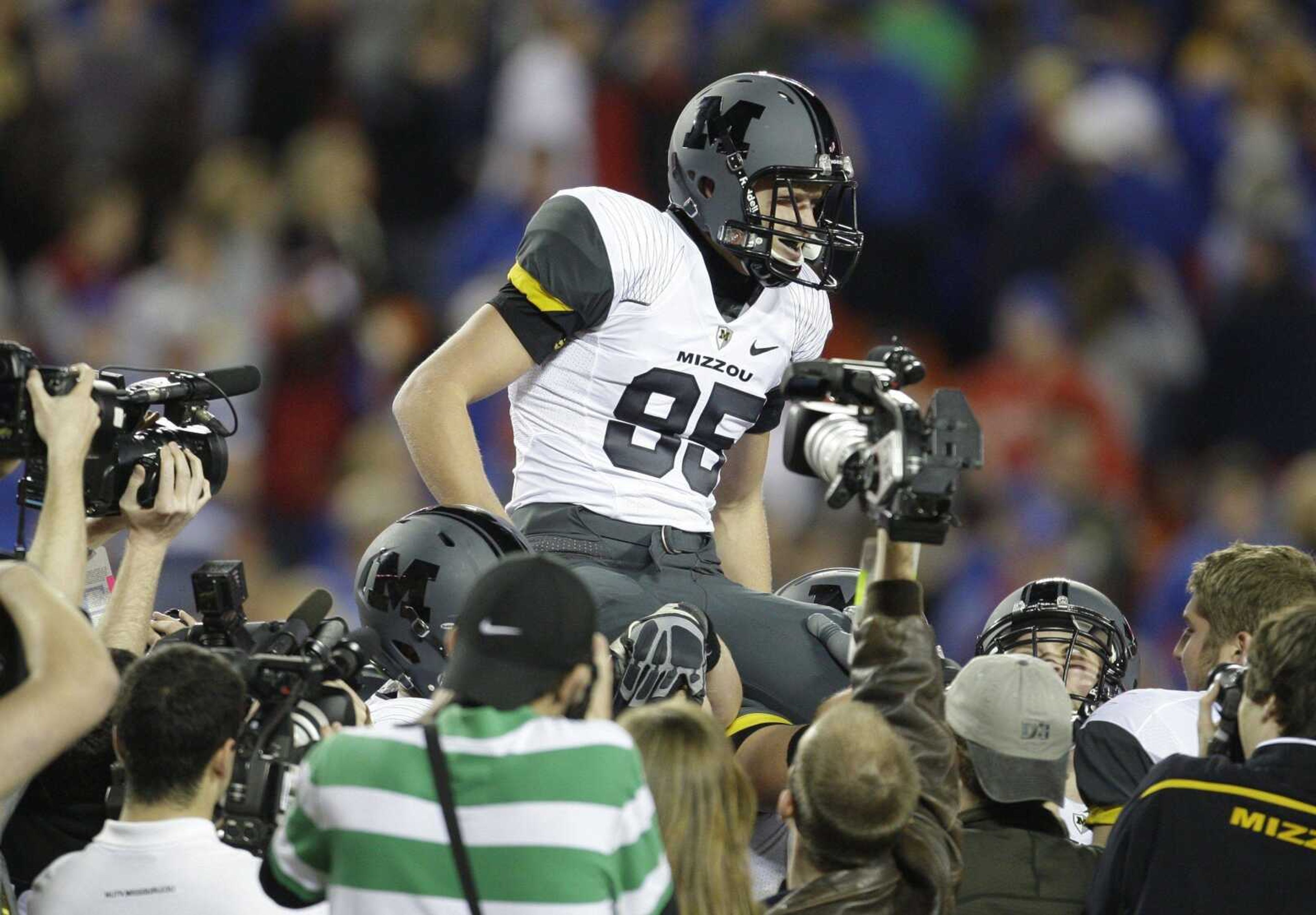 Grant Ressel is carried off the field by teammates after his last-second field goal beat rival Kansas during the 2009 season at Arrowhead Stadium in Kansas City, Mo.