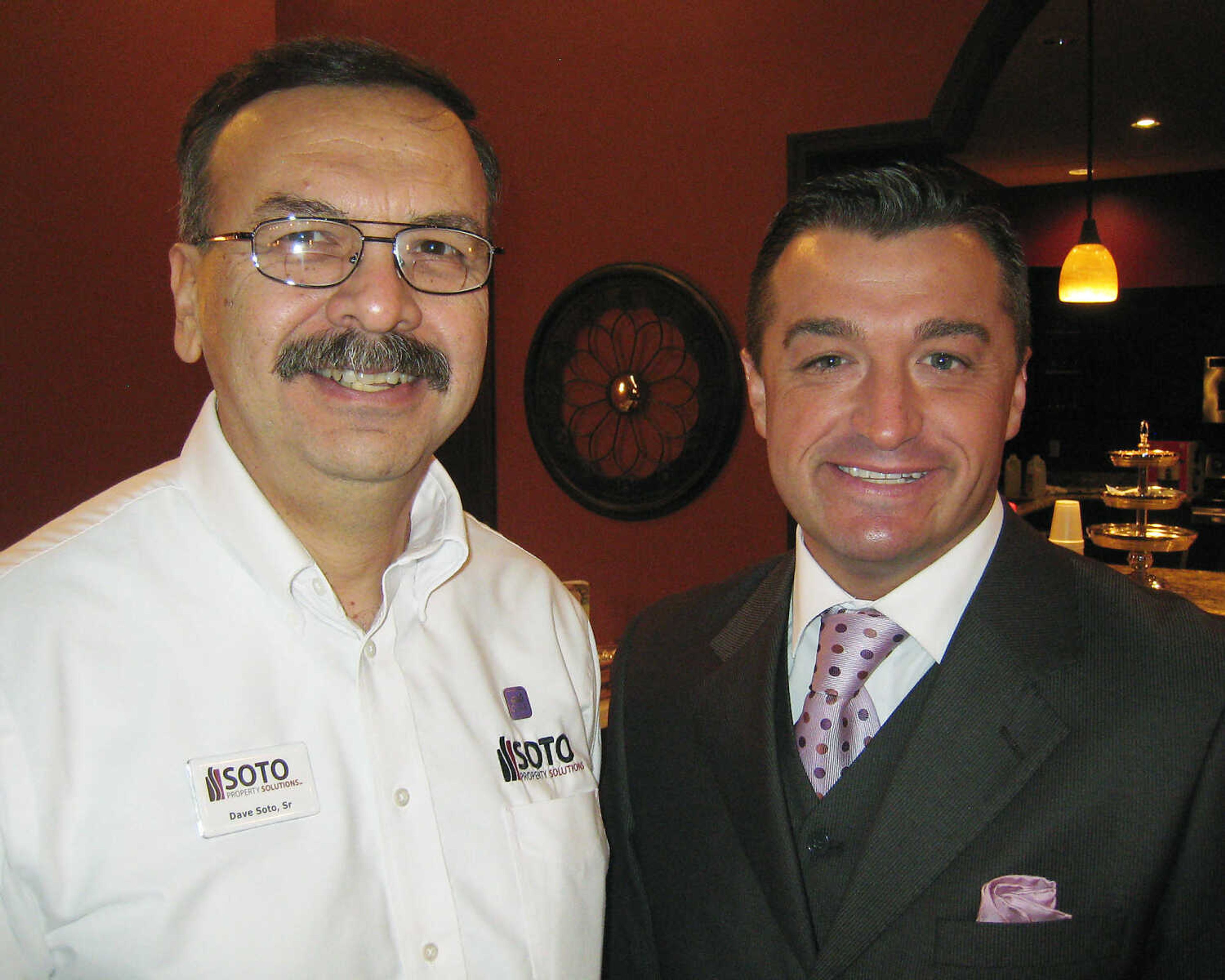 Dave Soto, Sr., Soto Property Solutions, left, and Brian Gerau, Jackson Area Chamber of Commerce at the Jackson Area Chamber of Commerce Business Breakfast, Feb. 15 at Creative Edge Inc. in Jackson.